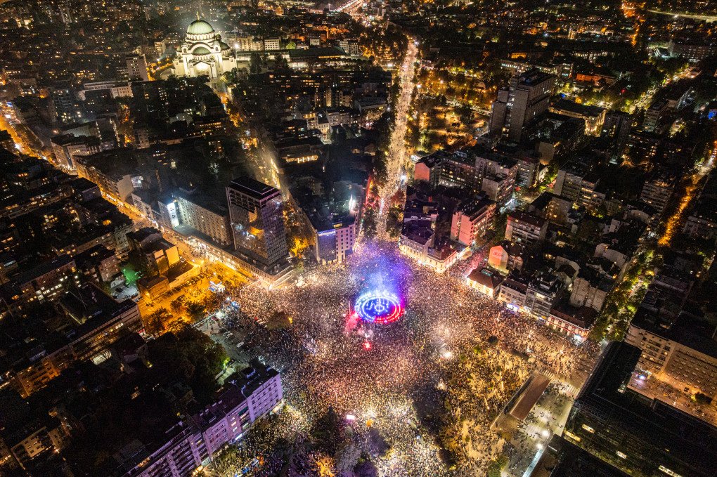 This aerial photograph shows supporters of the Students' List gathering at Slavija Square as they celebrate their victory a day after Serbia's snap parliamentary elections, in Belgrade on October 26, 2026. (Photo by Djordje Kostic via Getty Images)