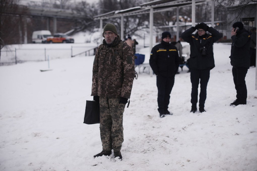 A Ukrainian soldier watches on as people gather to celebrate the Epiphany. Kyiv, Ukraine, January 6, 2026. (Photo: Lucile Brizard) A Ukrainian soldier watches on as people gather to celebrate the Epiphany. Kyiv, Ukraine, January 6, 2026. (Photo: Lucile Brizard)