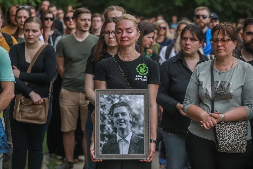 A woman holds the portrait of famous activist and military Roman Ratushnyi in Kyiv. (Photo by Oleksandr Khomenko/NurPhoto via Getty Images) A woman holds the portrait of famous activist and military Roman Ratushnyi in Kyiv. (Photo by Oleksandr Khomenko/NurPhoto via Getty Images)