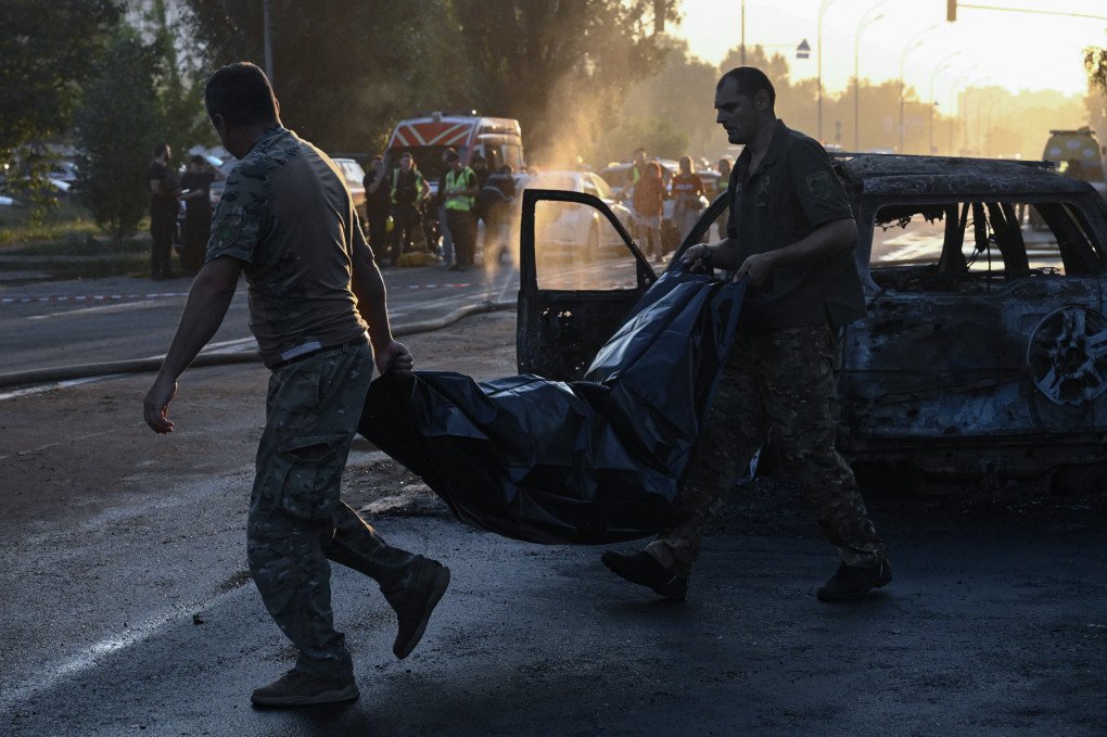 Police officers carry the body of a person killed in a Russian ballistic missile strike in Kyiv on August 1, 2026. (Source: Getty Images) Police officers carry the body of a person killed in a Russian ballistic missile strike in Kyiv on August 1, 2026. (Source: Getty Images)