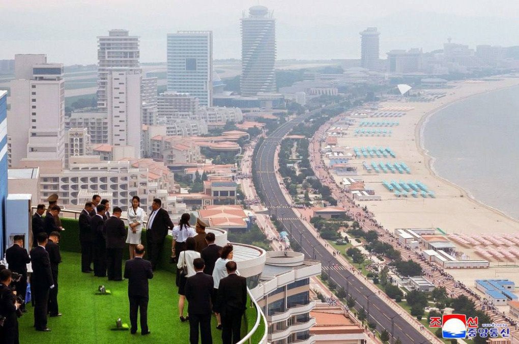 Kim Jong-Un tours rooftop viewpoint overlooking the new resort complex. (Source: KCNA)