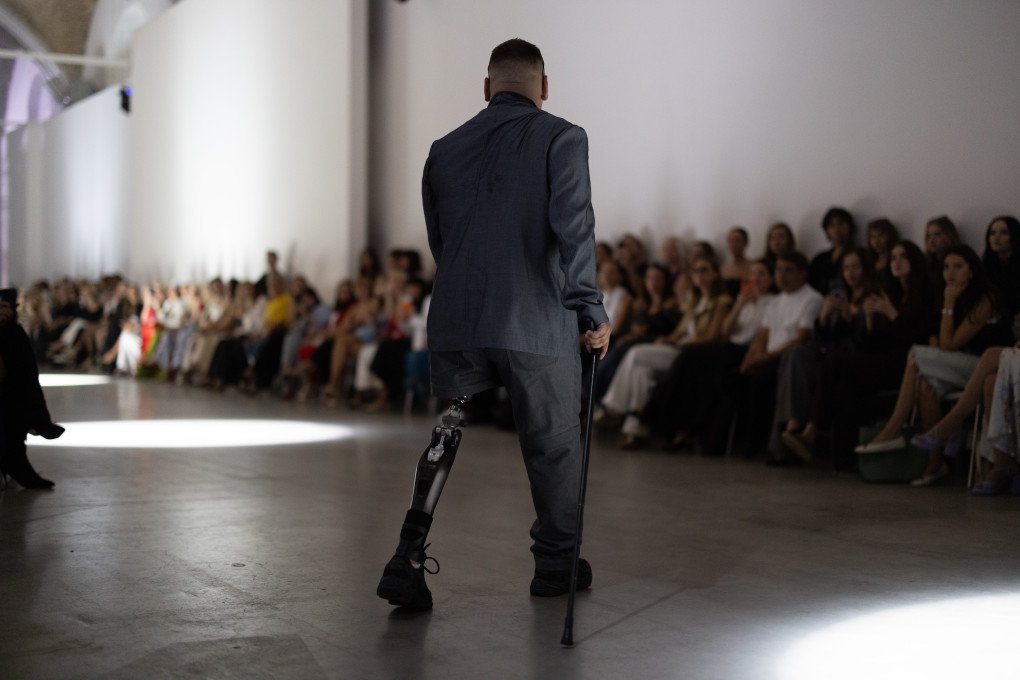 A Ukrainian veteran from the Azov Brigade presents a look from the JULIYA KROS SS2027 RECONSTRUCTION collection during Ukrainian Fashion Week in Kyiv on September 4, 2026. (Source: Vic Bakin/UNITED24 Media)