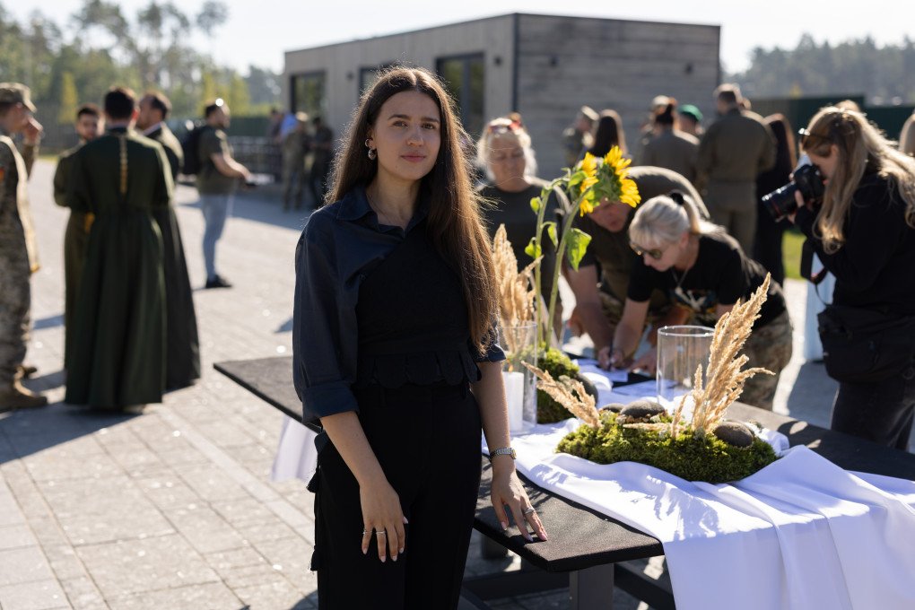 Maria beside one of the Memory Tables set up for Ukraine’s Day of Remembrance for Defenders. (Photo: Vic Bakin/UNITED24 Media) Maria beside one of the Memory Tables set up for Ukraine’s Day of Remembrance for Defenders. (Photo: Vic Bakin/UNITED24 Media)