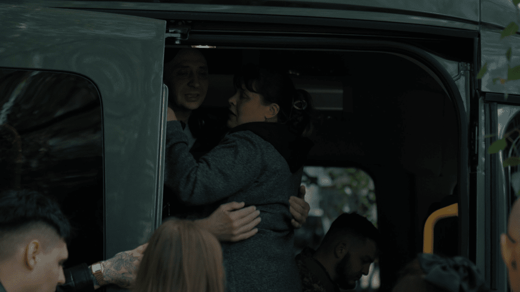 A woman hugs a recently released Ukrainian soldier through the door of a transport van. Photo: UNITED24 Media A woman hugs a recently released Ukrainian soldier through the door of a transport van. Photo: UNITED24 Media