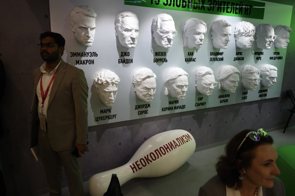 Visitors stand next to masks of Ukrainian President Volodymyr Zelenskyy, Facebook founder, CEO of Meta Mark Zuckerberg, French President Emmanuel Macron and Western politician, installed by Russian propaganda TV Channel RT at the exhibition during the Saint Petersburg International Economic Forum SPIEF'26 on June 4, 2026 in Saint Petersburg, Russia. (Photo by Contributor via Getty Images)
