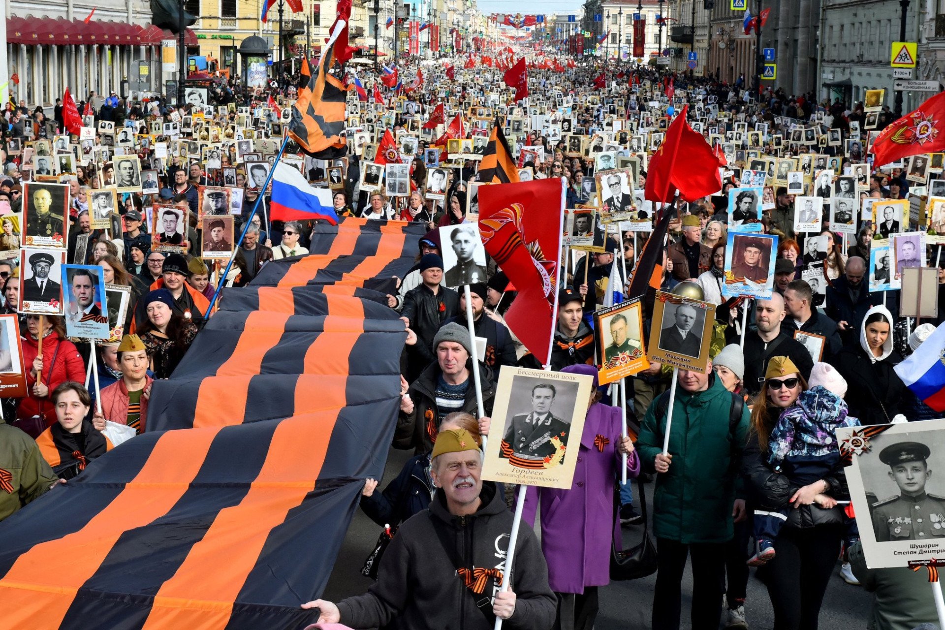 People carry portraits of their relatives as they take part in the Immortal Regiment march in central Saint Petersburg on May 9, 2022. (Source: Getty Images) People carry portraits of their relatives as they take part in the Immortal Regiment march in central Saint Petersburg on May 9, 2022. (Source: Getty Images)