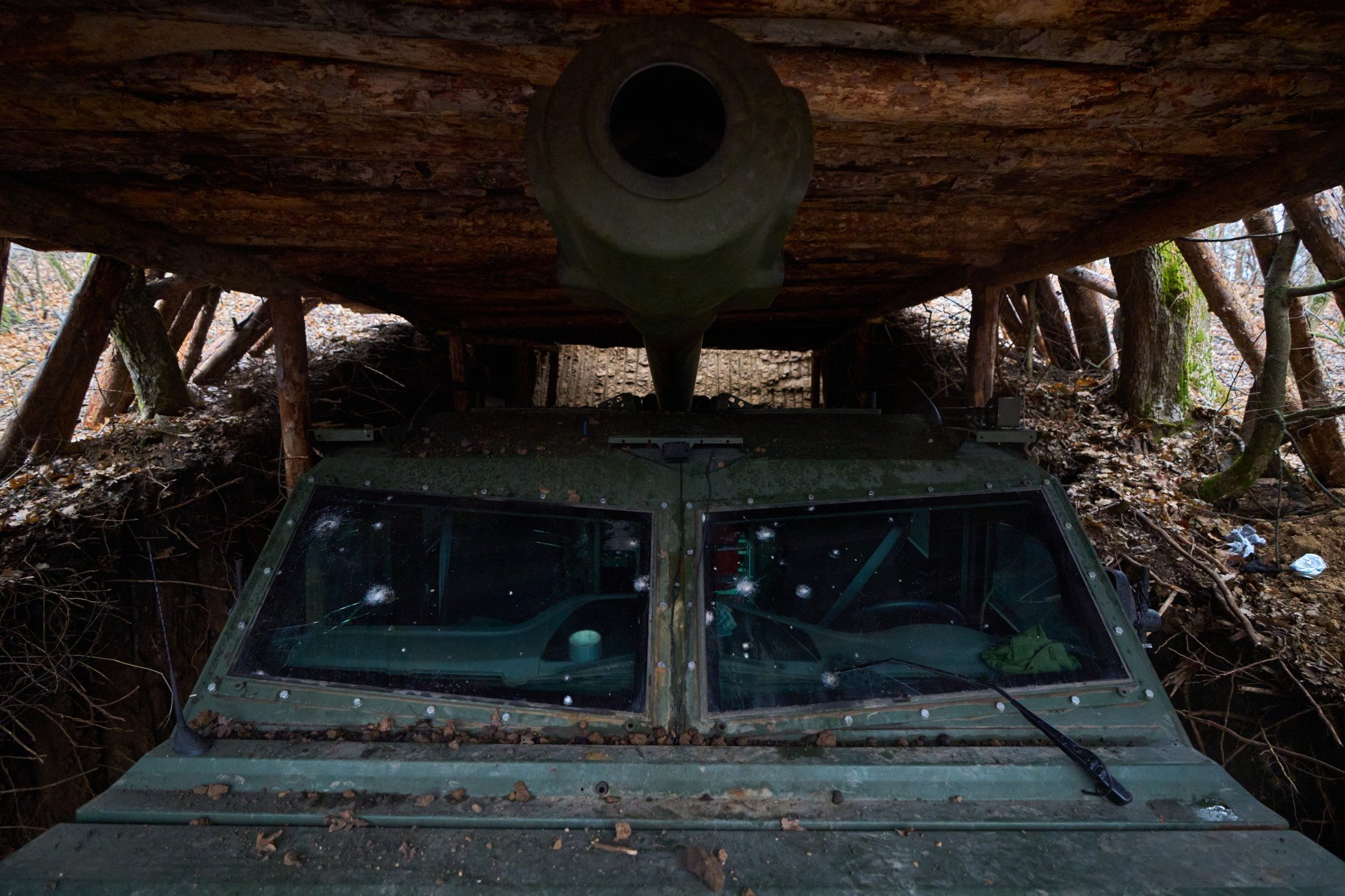From the outside, the 155mm cannon protrudes over the armored cabin. The dugout’s height was carefully calculated to fit the howitzer’s size and hide it from prying eyes and the threat of Russian FPV drones. The winter removed the foliage protecting the crew from Russian drones, which explains why the dugout encasing the howitzer has been carved so deep underground. The dugout was visibly excavated with the help of a bulldozer that left deep marks, meaning that this position was deemed safe enough to bring in construction equipment far from Russian troops' constant surveillance.