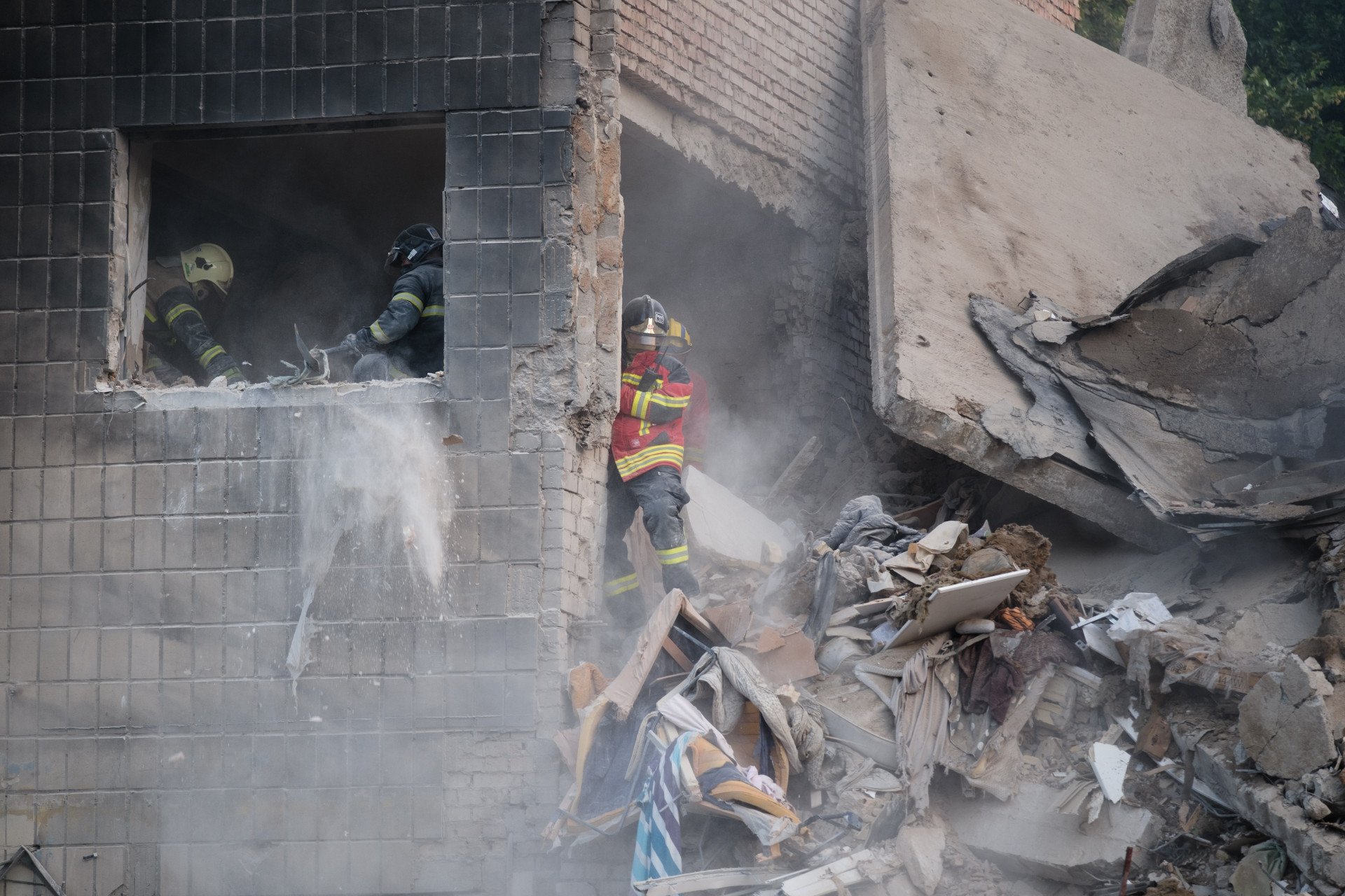 Rescuers conduct search and rescue operation at partially collapsed residential building after Russian drone-and-missile attack on June 17, 2025 in Kyiv, Ukraine. Rescuers continue to search for people under the rubble. (Photo by Vitalii Nosach via Getty Images)