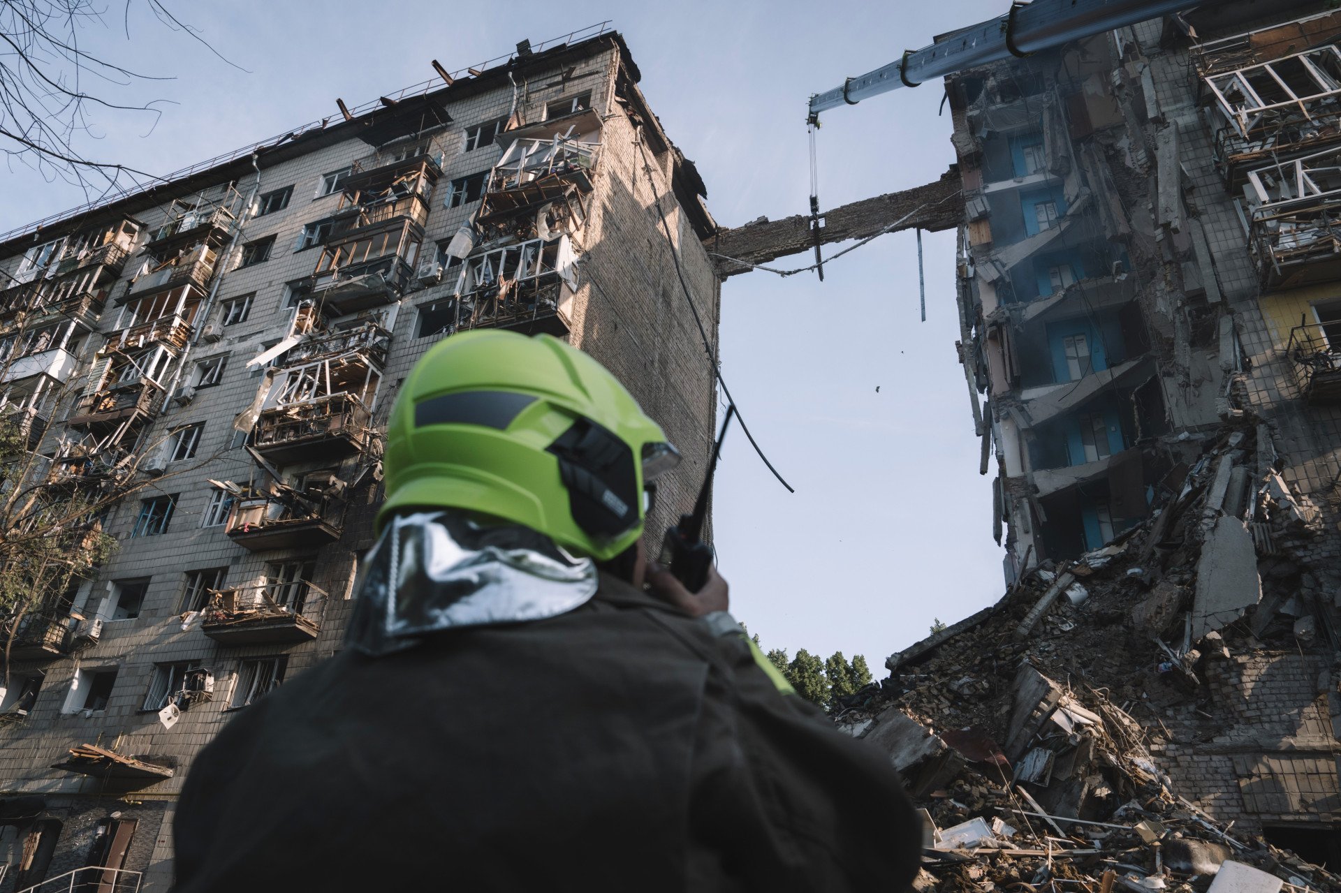 Rescue services search for victims under wreckage after an air strike on a residential building in Kyiv, Ukraine, on June 17, 2025. Russian air assaults on Ukrainian civilian infrastructure have intensified in recent weeks this is the most deadly since at least April. Photographer: Andrew Kravchenko via Getty Images