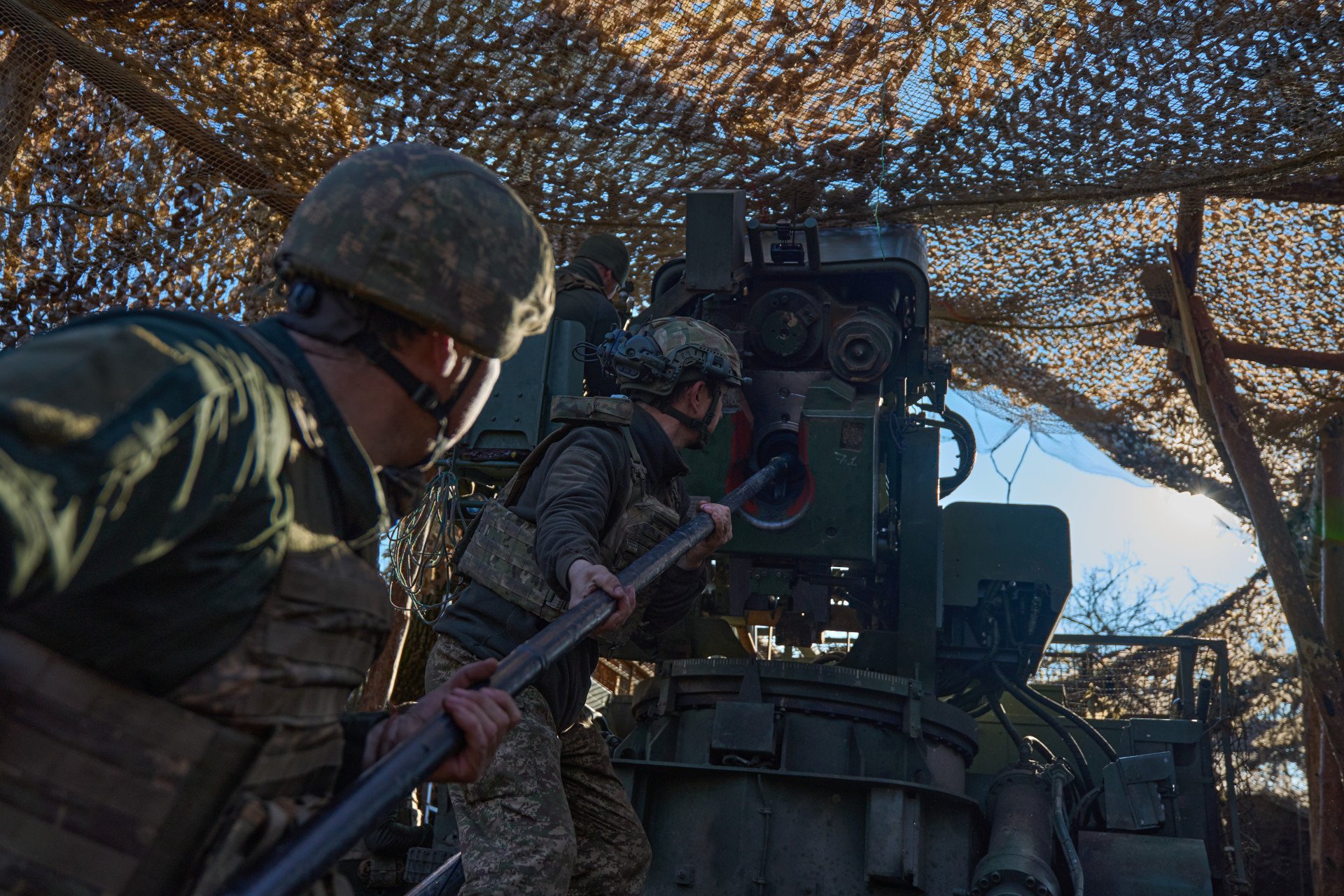 Ukrainian artillerymen load the “Bohdana” self-propelled artillery system, carefully guiding the shell into the barrel Bohdana Howitzer Caught in Action
