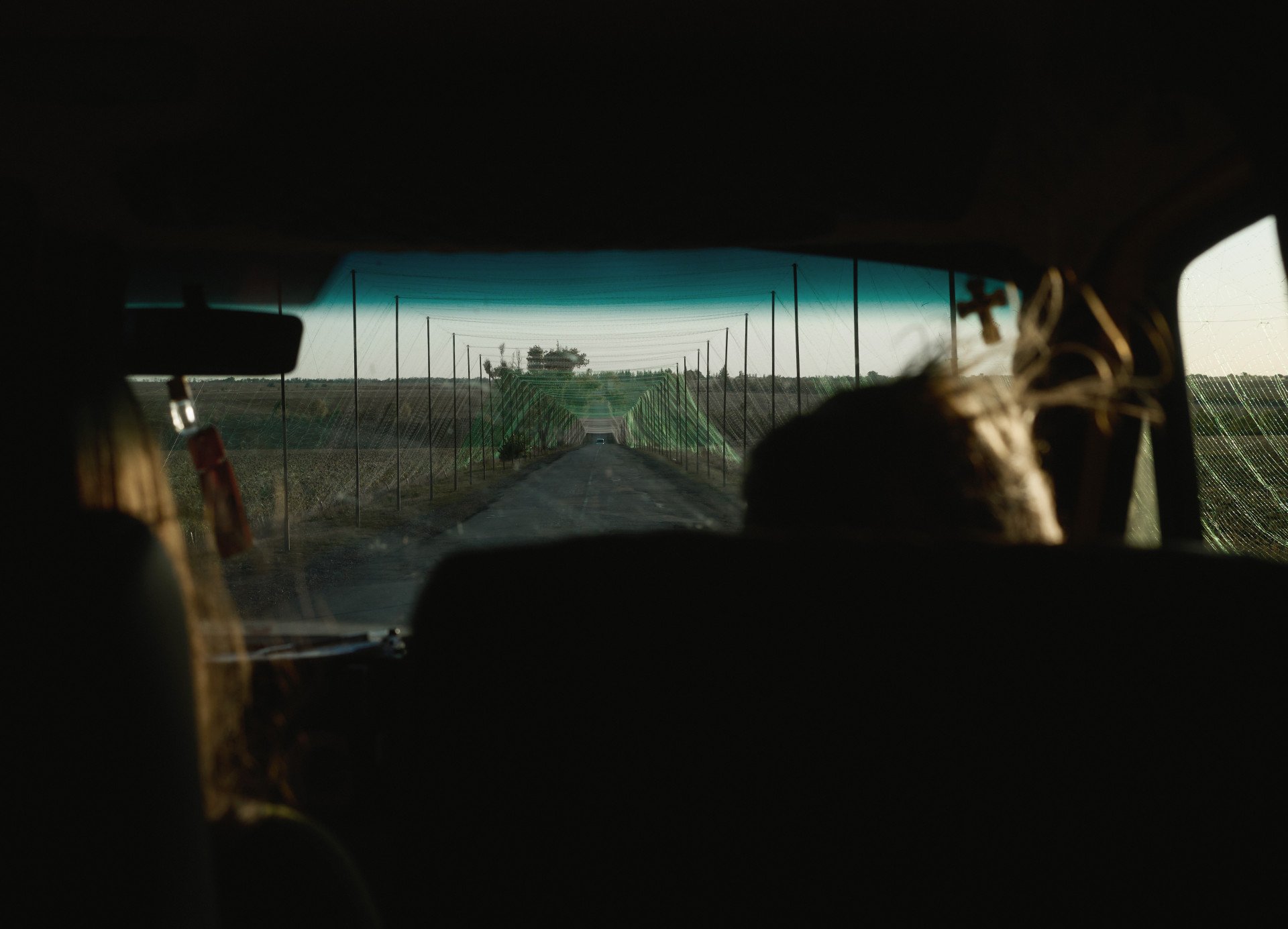 Local buses carry civilians and soldiers under anti-drone netting while coming in and out of the city. Kramatorsk, September 2025. Photo by Joshua Olley/UNITED24 Media.