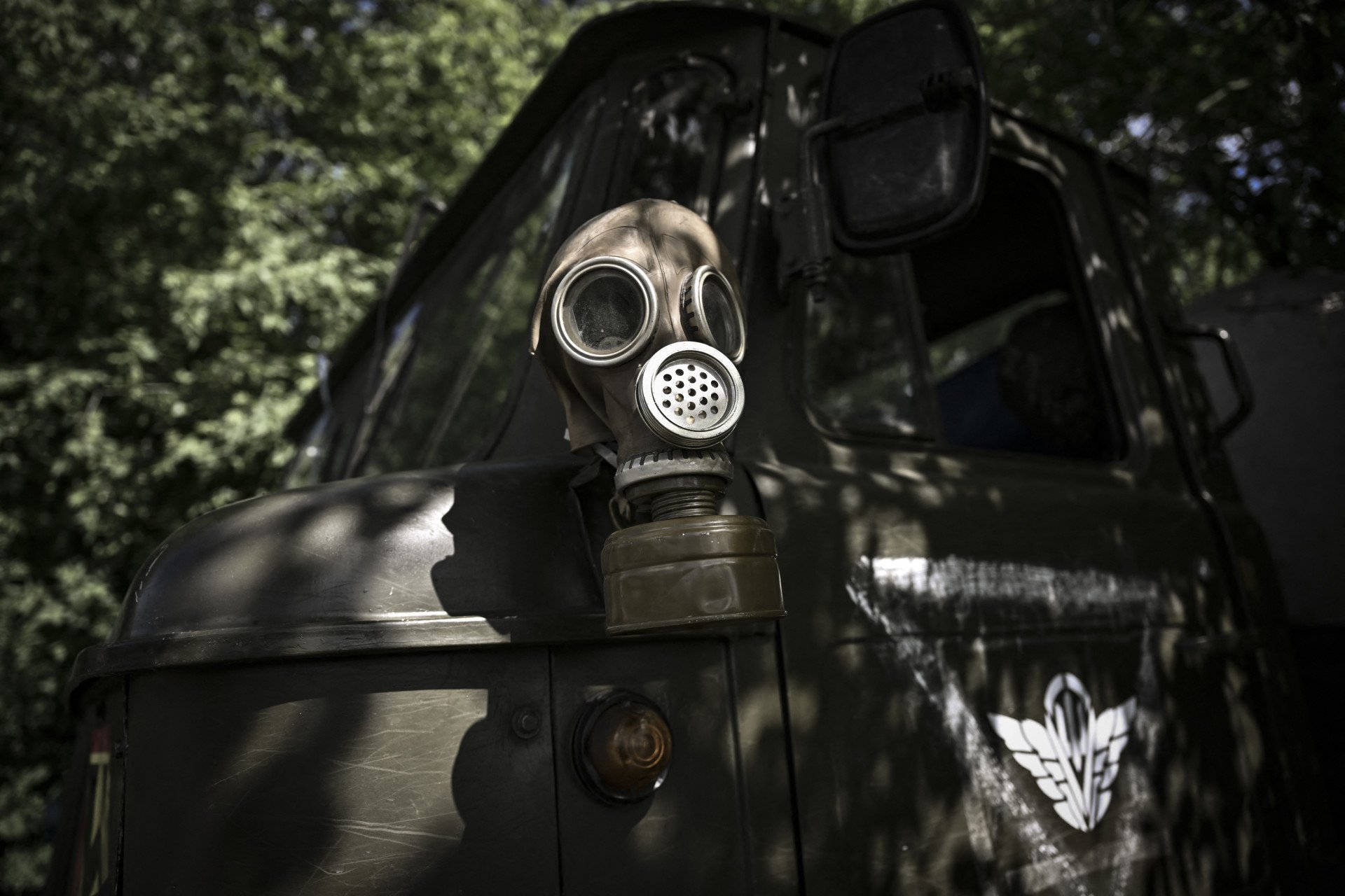 A gas mask is placed on a military vehicle at a check point held by Ukrainian Forces