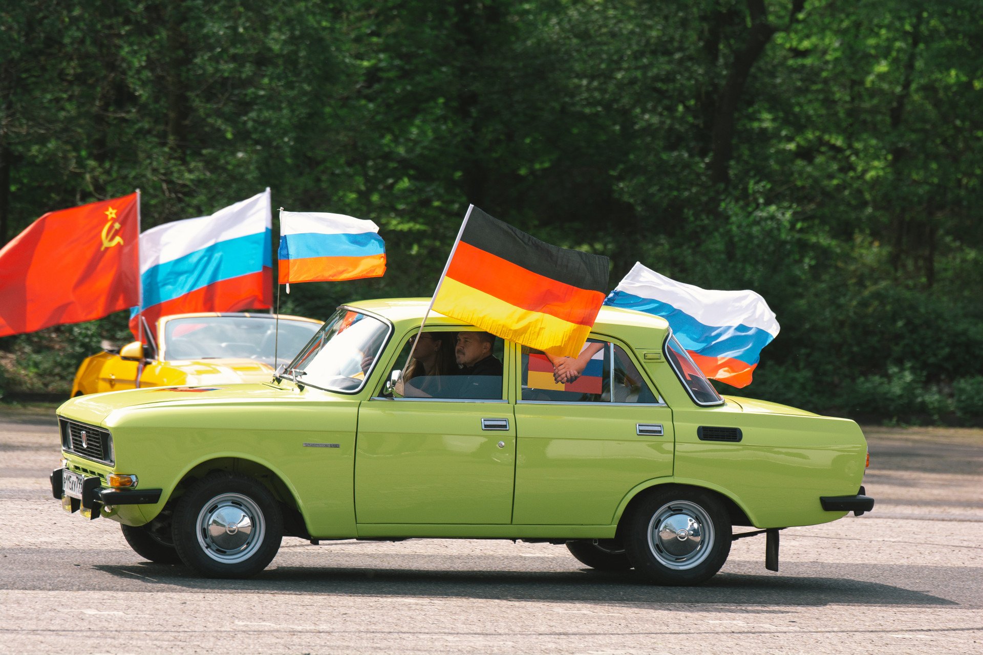 A car with Russian, German and Communist flags is seen driving by before the start of Pro Russian car parade to commemorate the 77th anniversary of Victory in Europe Day which marks the end of World War II in Europe in 1945 in Cologne, Germany on May 8, 2022 (Source: Getty Images) A car with Russian, German and Communist flags is seen driving by before the start of Pro Russian car parade to commemorate the 77th anniversary of Victory in Europe Day which marks the end of World War II in Europe in 1945 in Cologne, Germany on May 8, 2022 (Source: Getty Images)