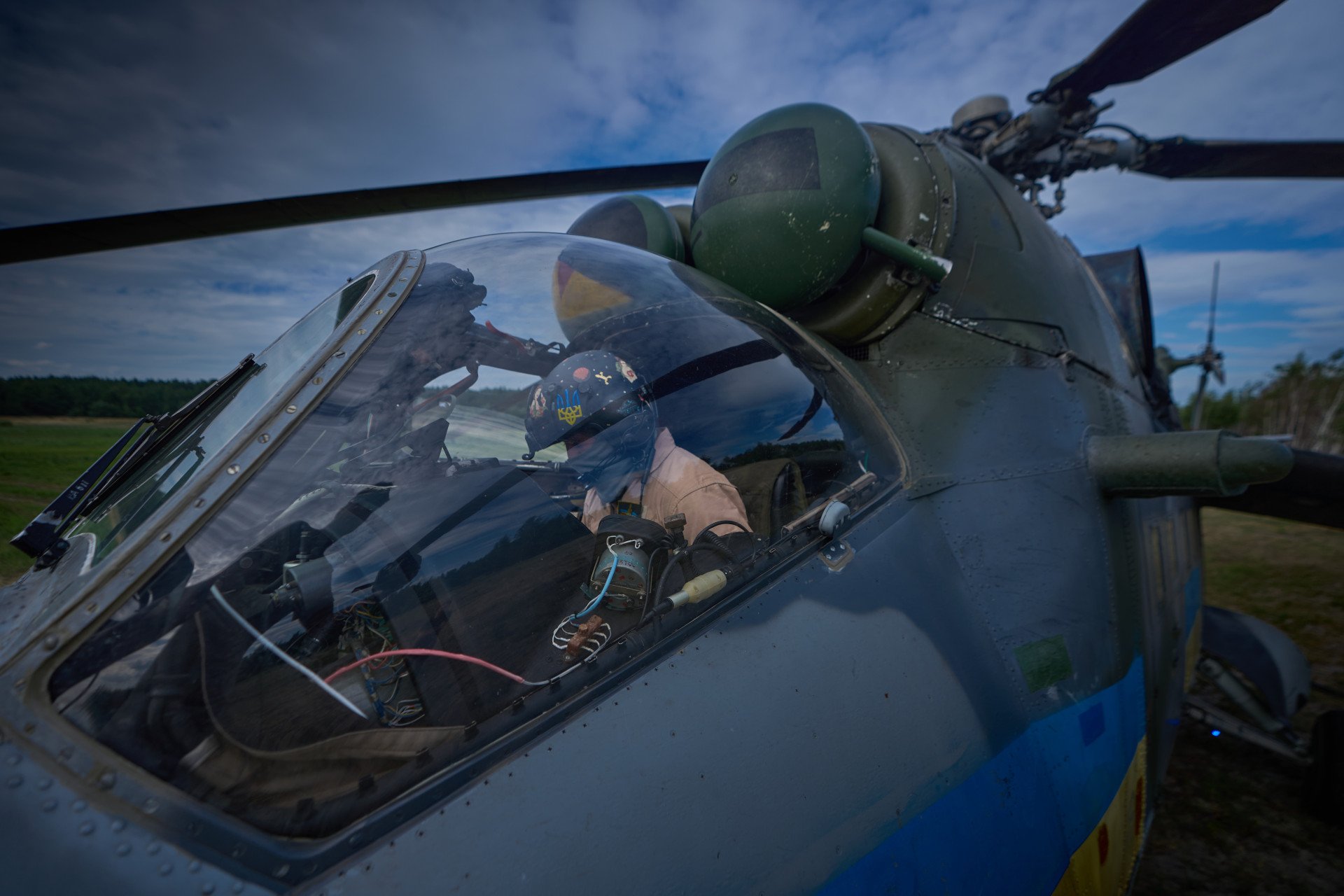 A Ukrainian pilot inside the cockpit of a Mi-24 helicopter, moments before takeoff. A Ukrainian pilot inside the cockpit of a Mi-24 helicopter, moments before takeoff.