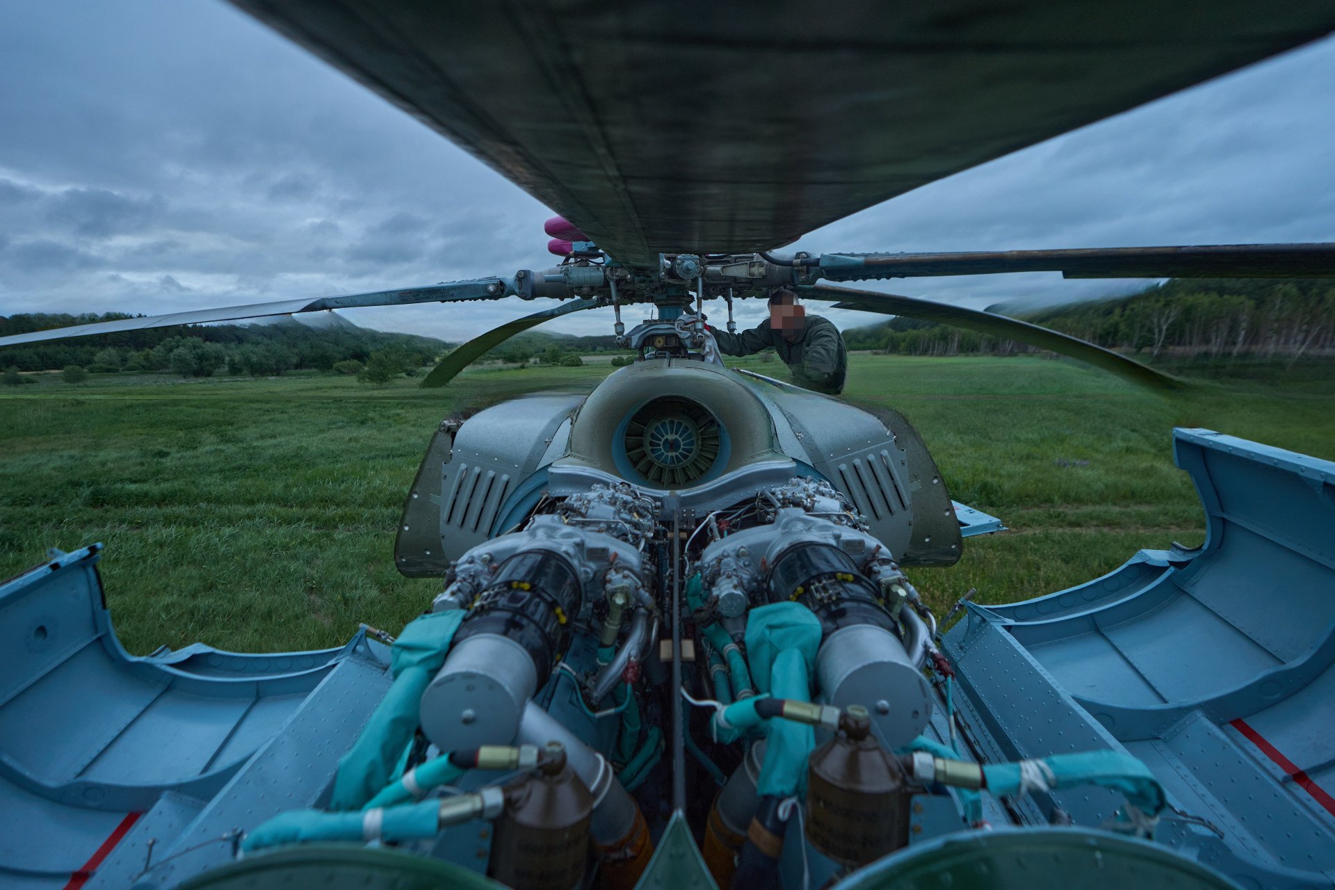 Ukraine’s flight engineer inspects the Mi-8 helicopter’s engine and rotor blades before the aircraft heads out on its next combat mission. Ukraine’s flight engineer inspects the Mi-8 helicopter’s engine and rotor blades before the aircraft heads out on its next combat mission.