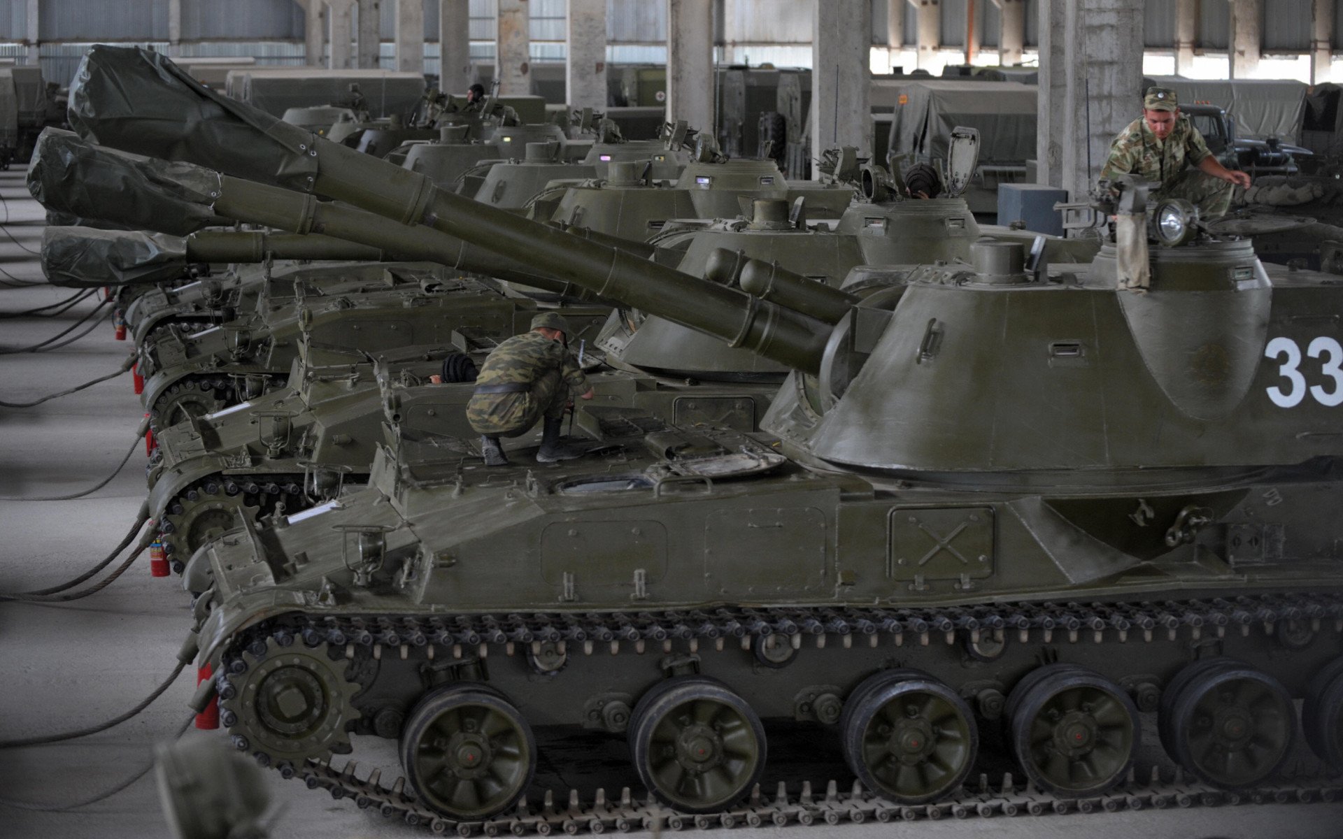 Russian soldiers prepare tanks at the Tskhinvali military base in August 2009, during heightened tensions following the war with Georgia over South Ossetia.