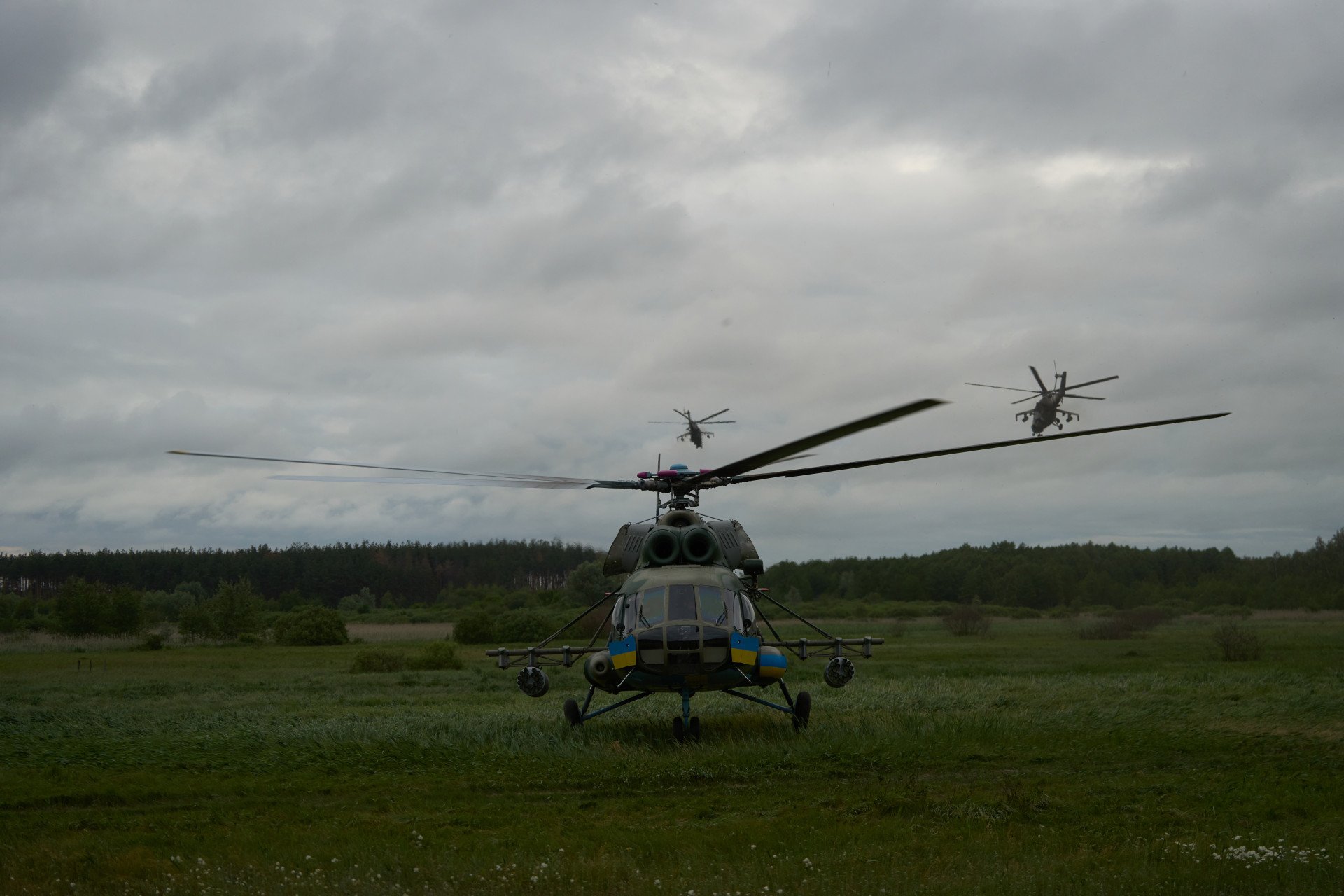 Mi-24 helicopters lift off on a combat mission. Mi-24 helicopters lift off on a combat mission.