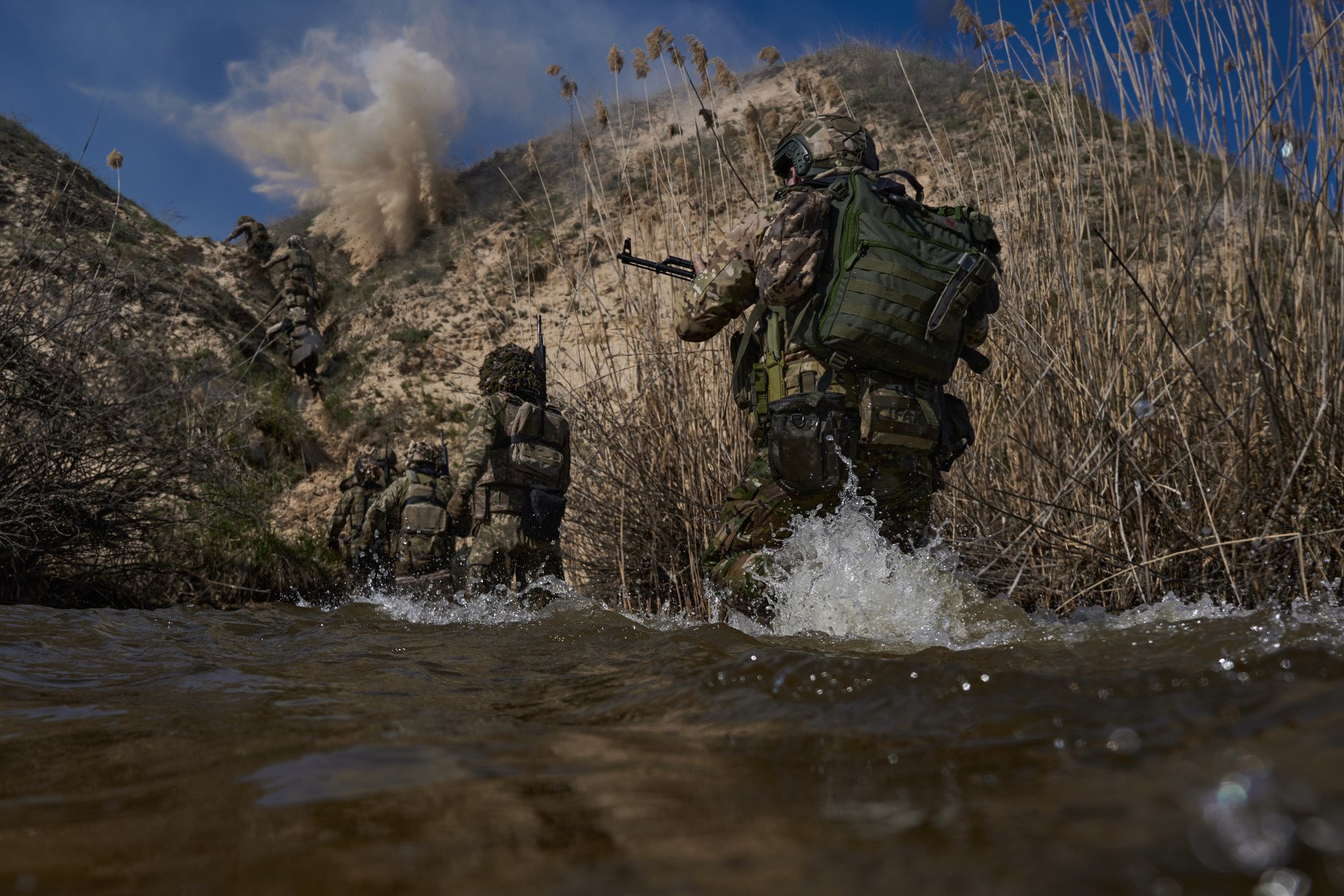 Training simulates real combat conditions, including enemy drone attacks dropping improvised explosive devices during landing exercises. Training simulates real combat conditions, including enemy drone attacks dropping improvised explosive devices during landing exercises.