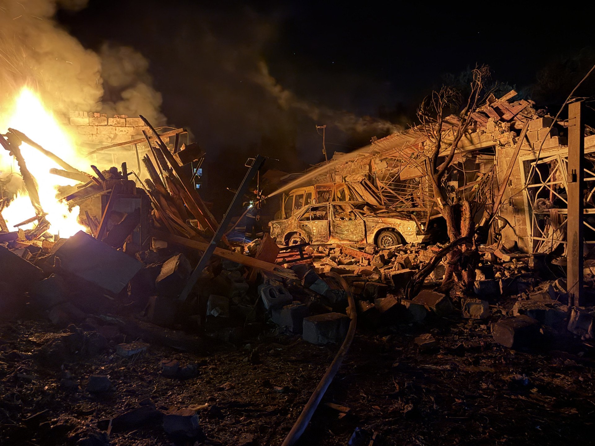 A Ukrainian rescuer works at the site of a Russian strike in Zaporizhzhia on August 11, 2026.