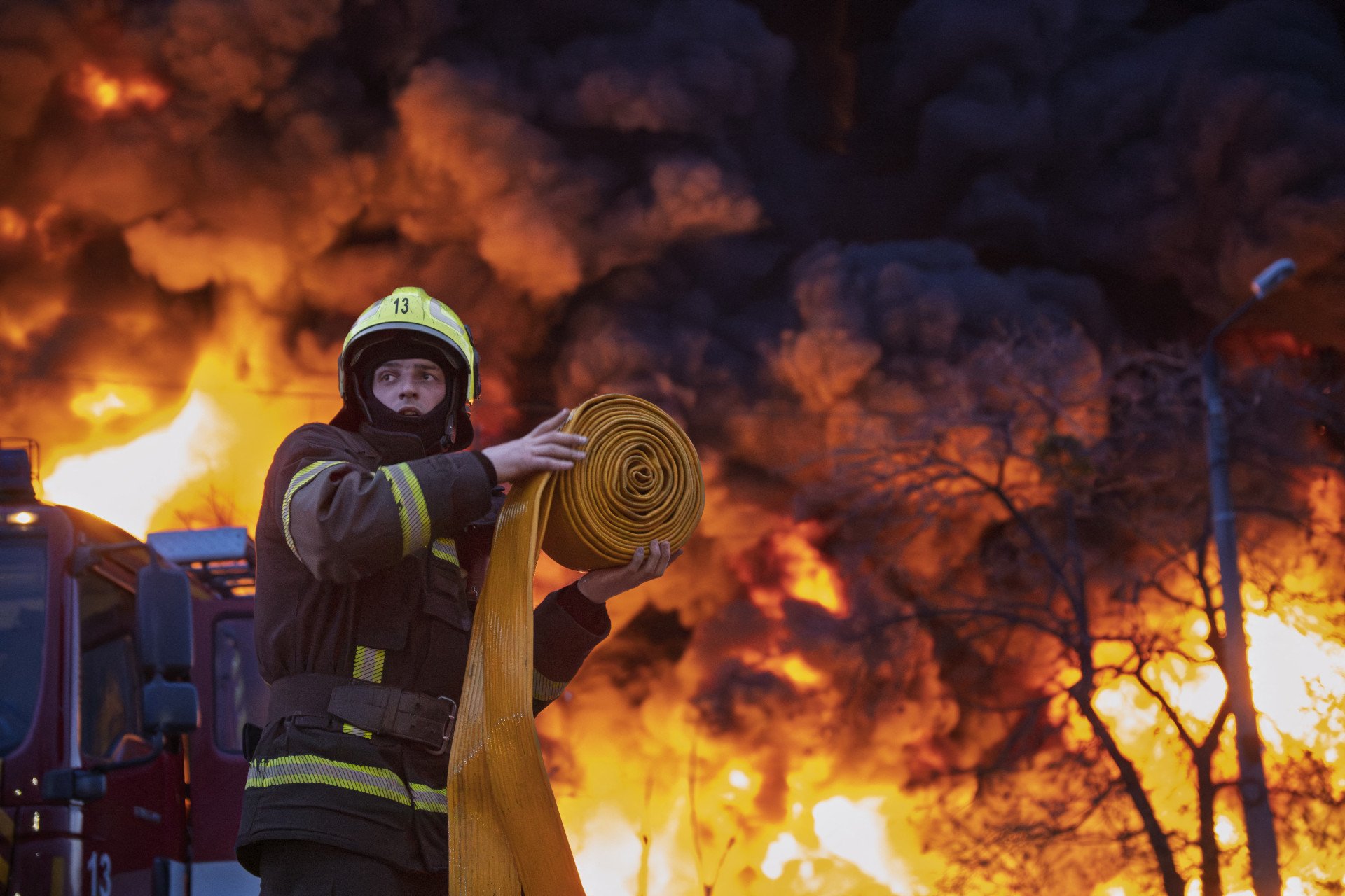 A firefighter works to extinguish a blaze at a recycling materials site following a Russian strike in Kyiv on April 16, 2026. (Source: Getty Images)