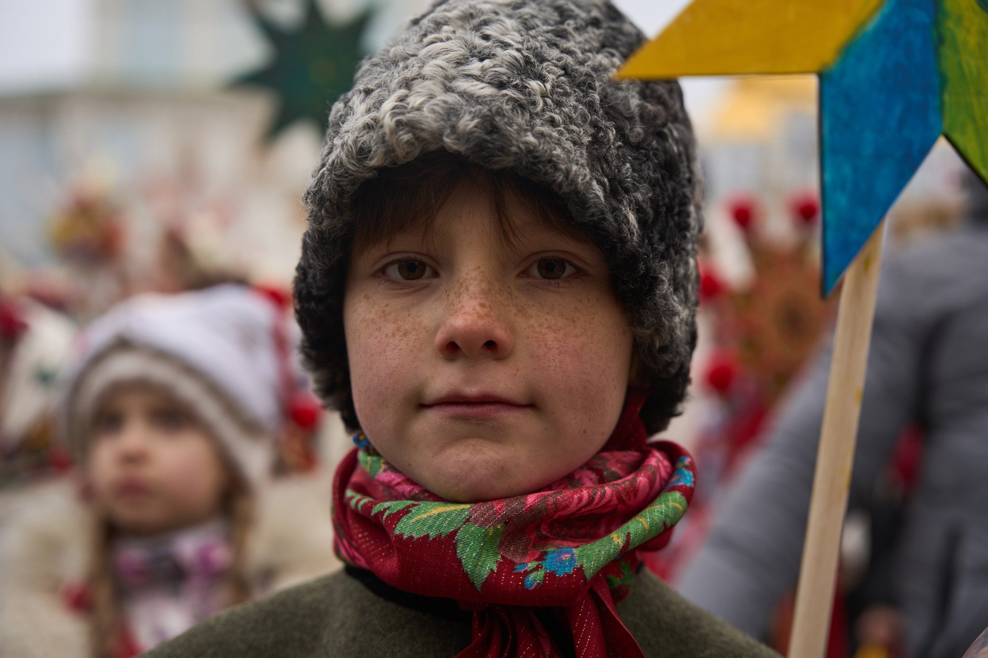 Kids and adults alike proudly hold their Christmas stars.