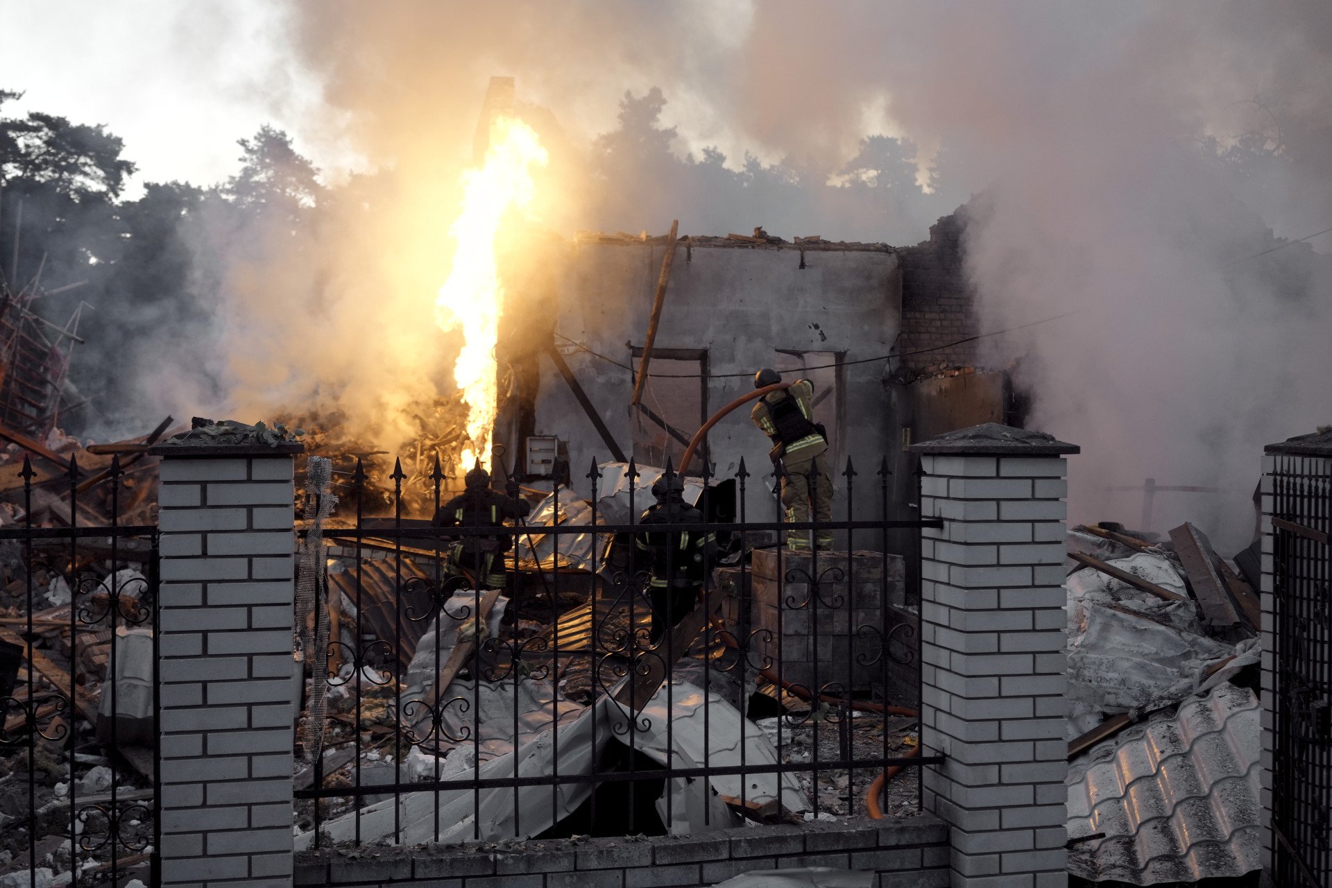 Firefighters extinguish an overturned vehicle that caught fire due to the Russian missile and drone strikes. (Source: Lucile Brizard/UNITED24 Media) Firefighters extinguish an overturned vehicle that caught fire due to the Russian missile and drone strikes. (Source: Lucile Brizard/UNITED24 Media)
