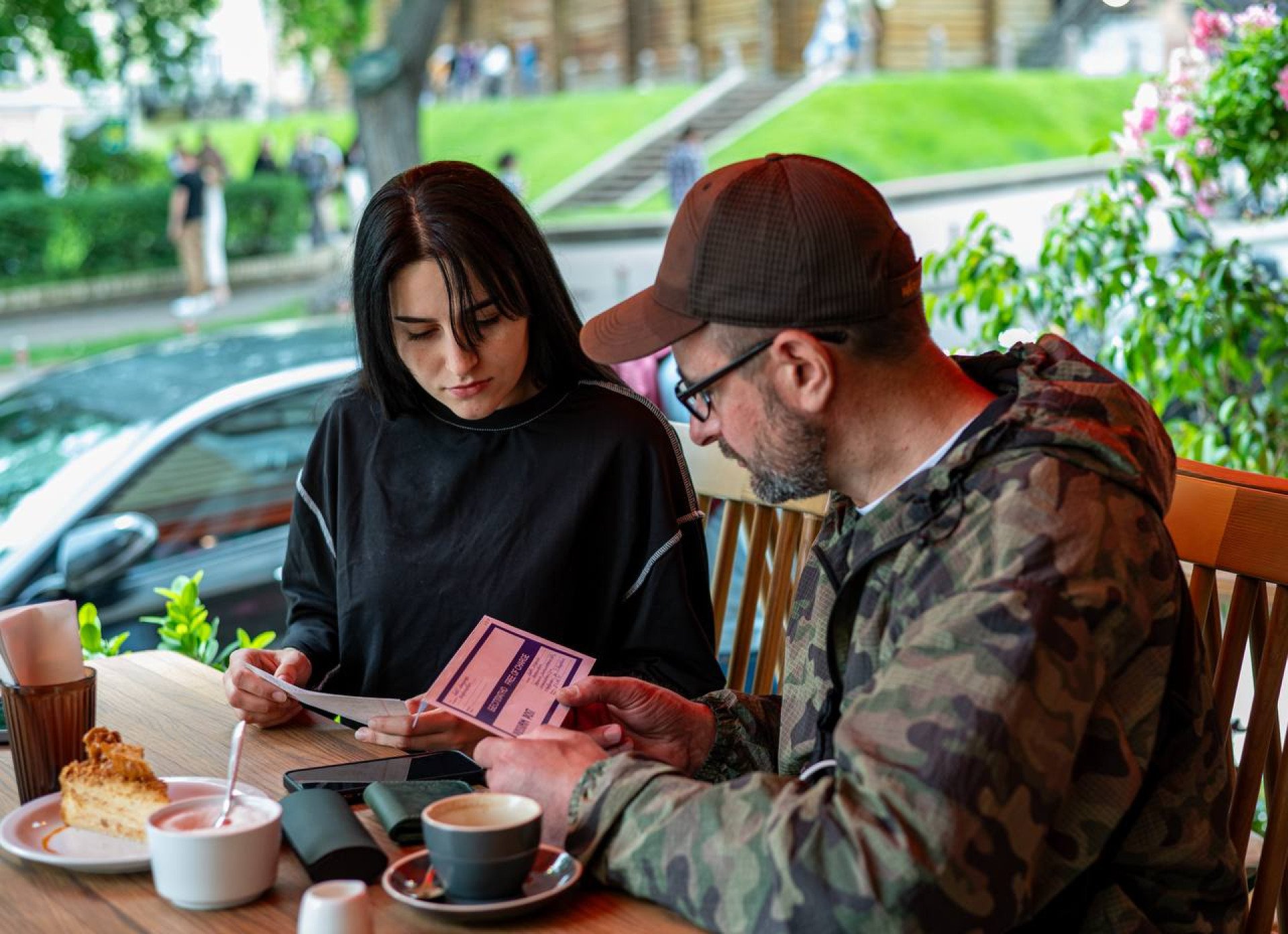 Anastasia Savova with her father, Oleksandr Savov, look through the only letter that she received from him during his captivity. Kyiv Ukraine. Photo by Artem Derkachov Anastasia Savova with her father, Oleksandr Savov, look through the only letter that she received from him during his captivity. Kyiv Ukraine. Photo by Artem Derkachov