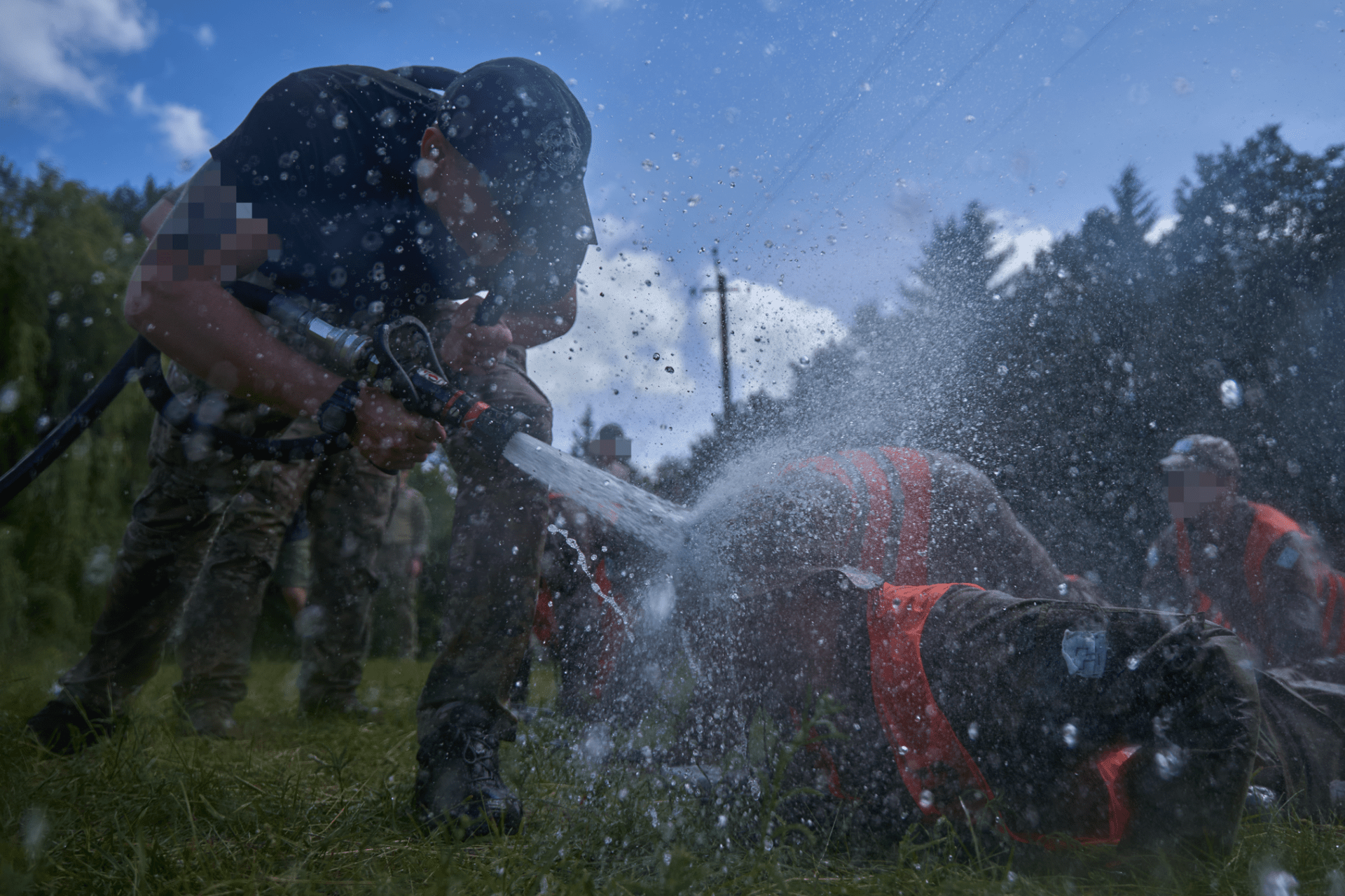 During physical exercises, candidates are drenched with water—so thoroughly that they can’t even catch a breath. During physical exercises, candidates are drenched with water—so thoroughly that they can’t even catch a breath.