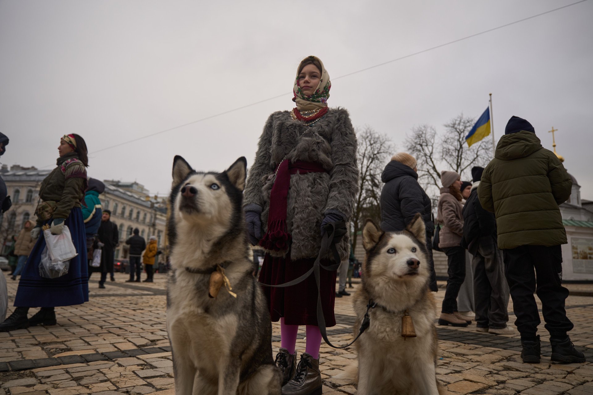 A procession participant with two good boys/girls!