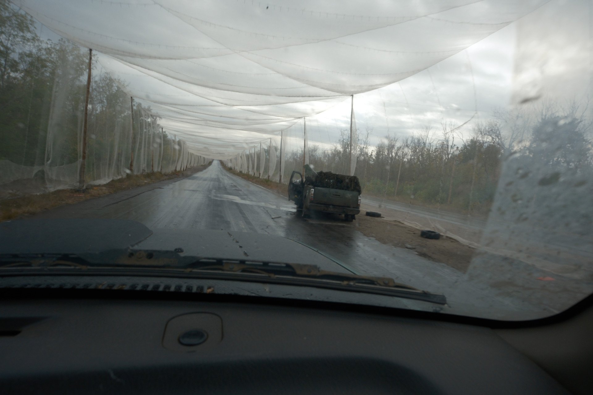 Anti-drone nets cover a road on the frontline, unspecified, Ukraine. Photo provided by the Communications Department of the 93rd Brigade “Kholodnyi Yar.”