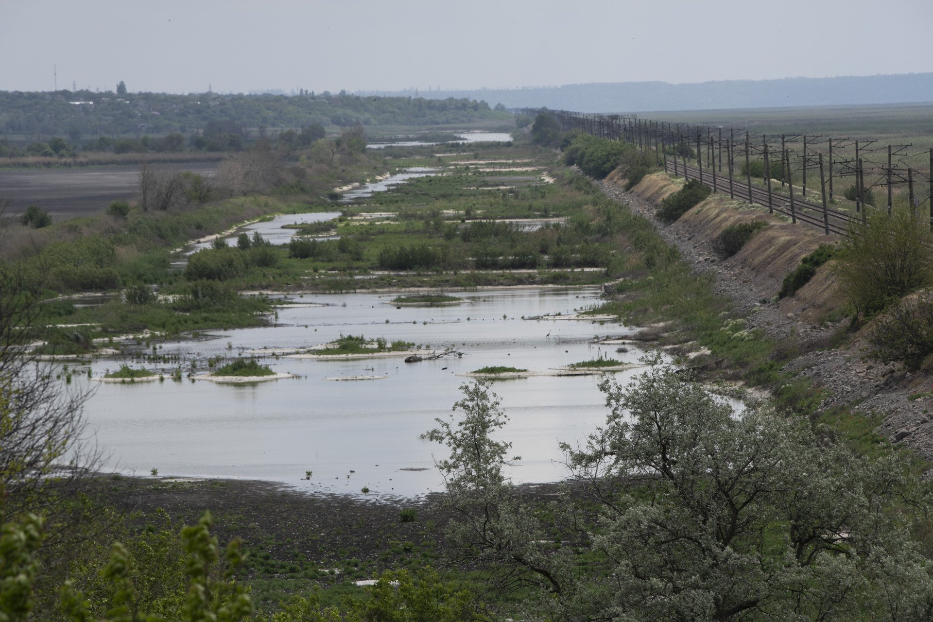 The remains of the Kakhovka Reservoir wind through the landscape—part river, part marsh, and now a cradle for new life. Photo: Oleksii Filippov (Instagram: @filippov_af) The remains of the Kakhovka Reservoir wind through the landscape—part river, part marsh, and now a cradle for new life. Photo: Oleksii Filippov (Instagram: @filippov_af)