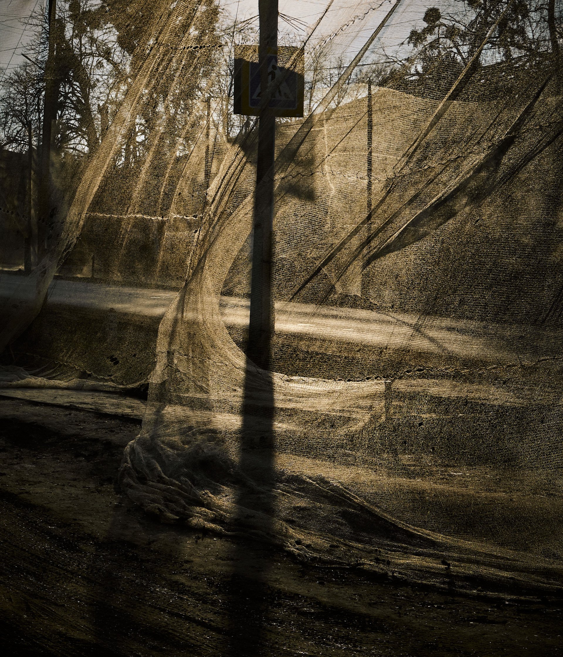 Anti-drone netting in central Izium. In response to recent drone attacks, Izium is taking precautions by building anti-drone infrastructure throughout the city. December 23, 2025. Photo by Joshua Olley/UNITED24 Media. Anti-drone netting in central Izium. In response to recent drone attacks, Izium is taking precautions by building anti-drone infrastructure throughout the city. December 23, 2025. Photo by Joshua Olley/UNITED24 Media.
