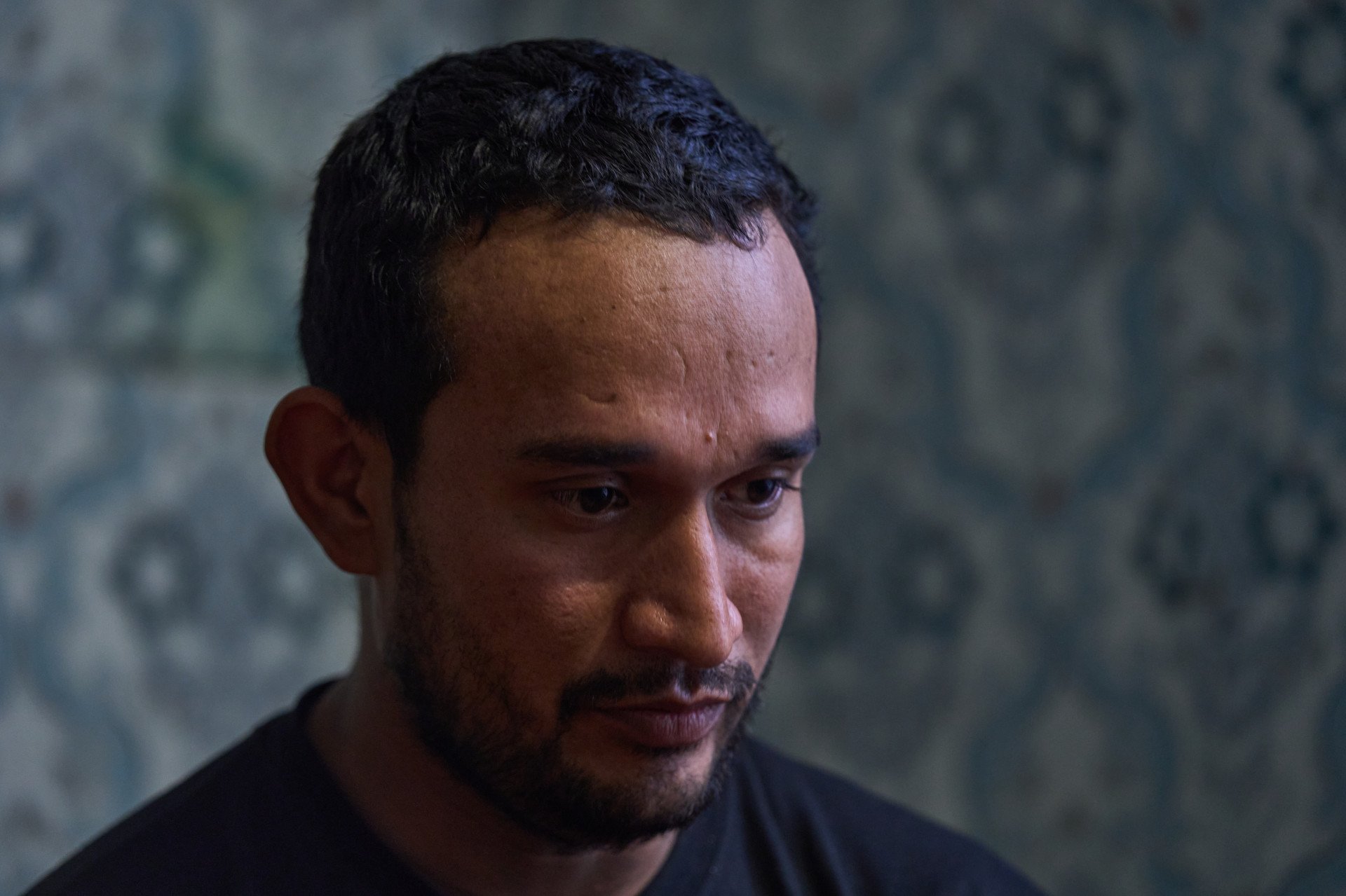 Gustavo Andrés Roa Leal, a Colombian prisoner of war in Ukraine, was promised non-combat military support work in Moscow, only to be forced directly into high-risk frontline assaults upon arrival. (Photo: Mykyta Shandyba / UNITED24 Media) Close-up portrait of Gustavo Andrés Roa Leal, a Colombian prisoner of war in Ukraine lured to Russia by false promises of support work.