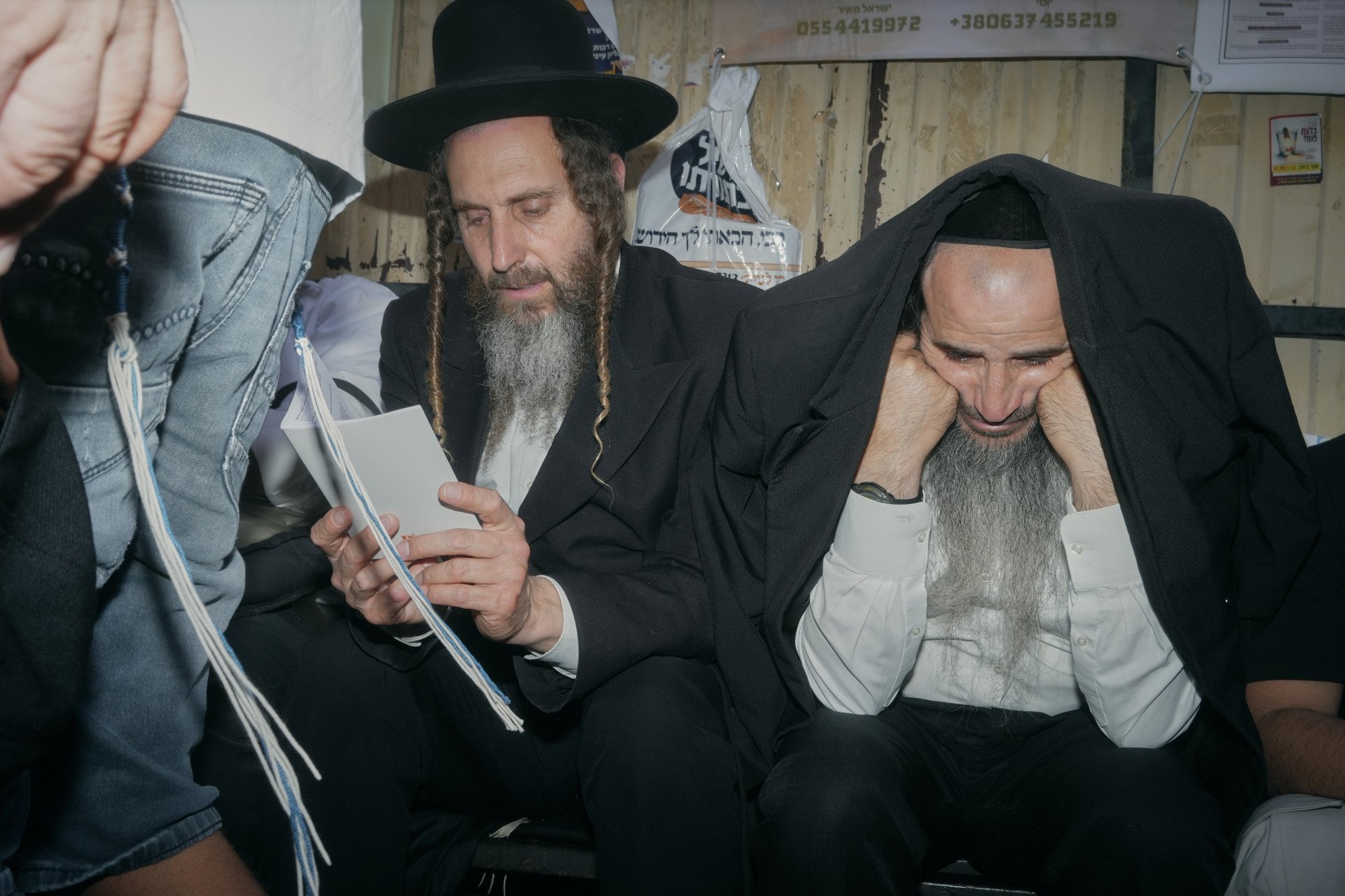 Two Hasids pray outside of the synagogue where Rabbi Nachman of Bratslav is buried. Uman, Ukraine. September, 2025. Photo: Josh Olley/UNITED24 Media