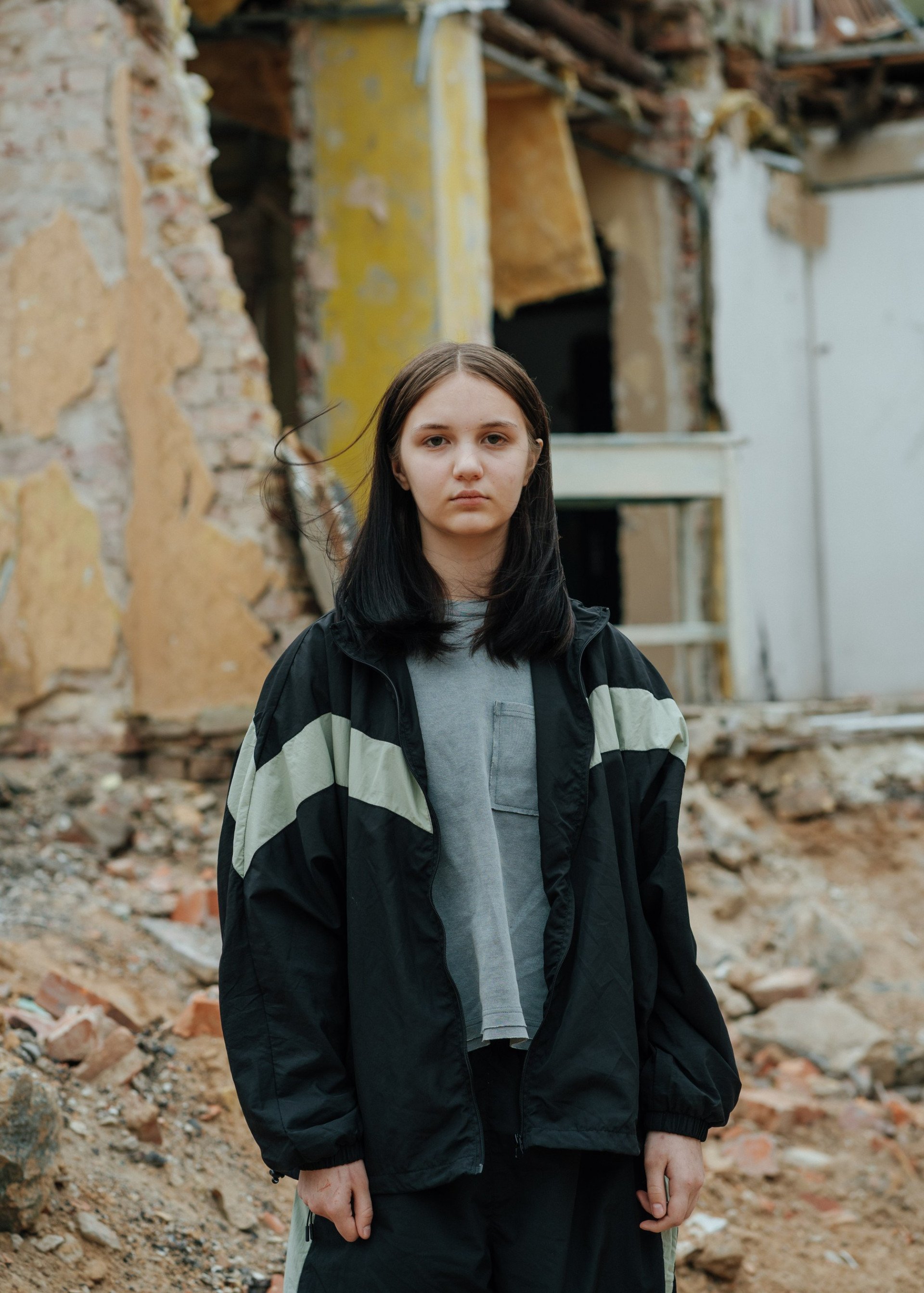14-year-old Yana stands in front of the remains of her home destroyed by a Russian missile, May 20, 2025. (Source: Andrii Yushchak) 14-year-old Yana stands in front of the remains of her home destroyed by a Russian missile, May 20, 2025. (Source: Andrii Yushchak)