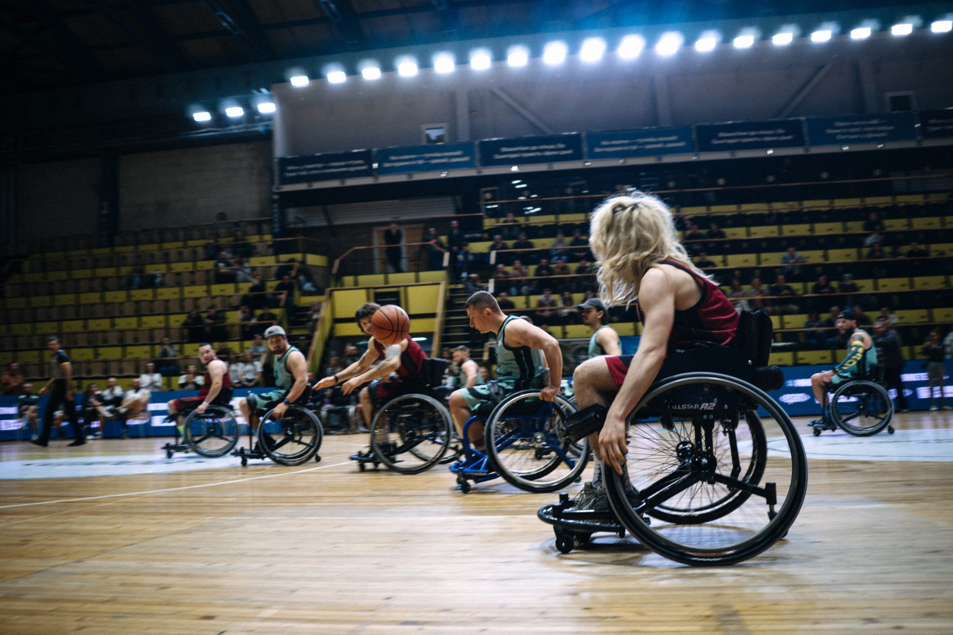 Players race across the court in a high-speed play, keeping the crowd on edge at Ukraine’s first All-Ukrainian Wheelchair Basketball Tournament. Photo: Tim Pushkaruk, Come Back Alive Foundation Players race across the court in a high-speed play, keeping the crowd on edge at Ukraine’s first All-Ukrainian Wheelchair Basketball Tournament. Photo: Tim Pushkaruk, Come Back Alive Foundation