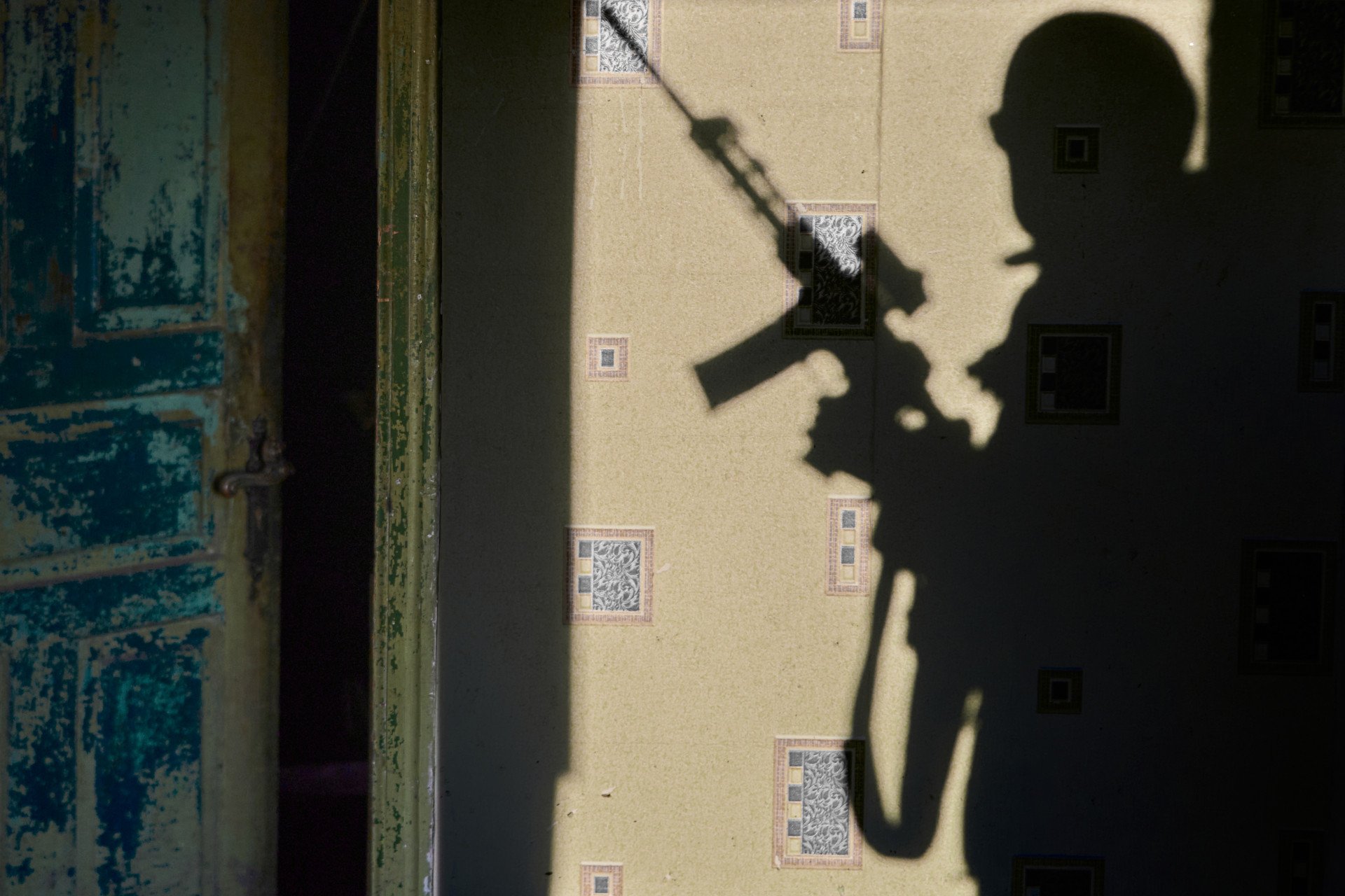 MAR 8 — A cold morning near Siversk, Donetsk region. The golden light of dawn casts long shadows of Ukrainian soldiers on the walls of their shelter. The 10th Edelweiss Brigade — defending Ukraine for over a decade — stands ready to fight until peace comes. (Photo by Mykyta Shandyba @mykyta_shandyba)