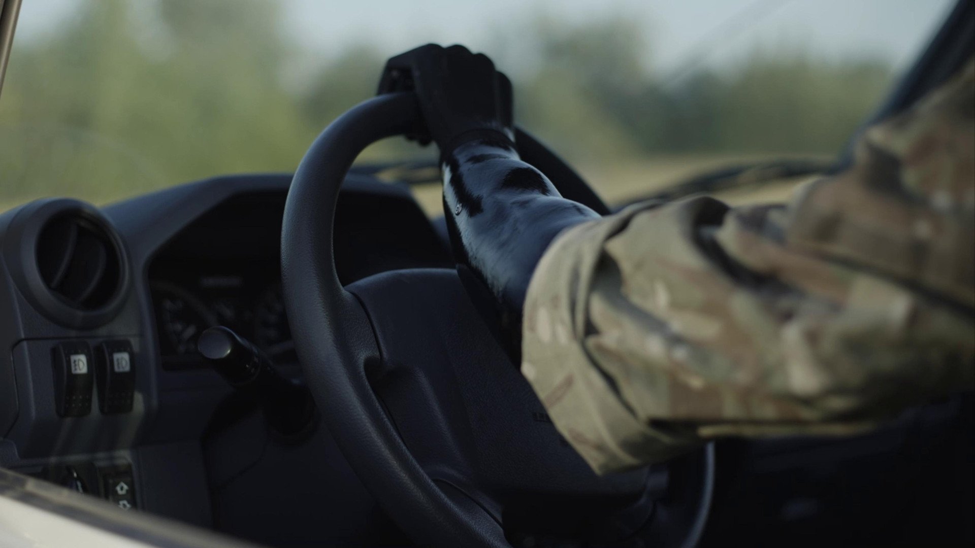 A person uses a prosthetic arm while driving a vehicle. (Source: Brave1's press office)