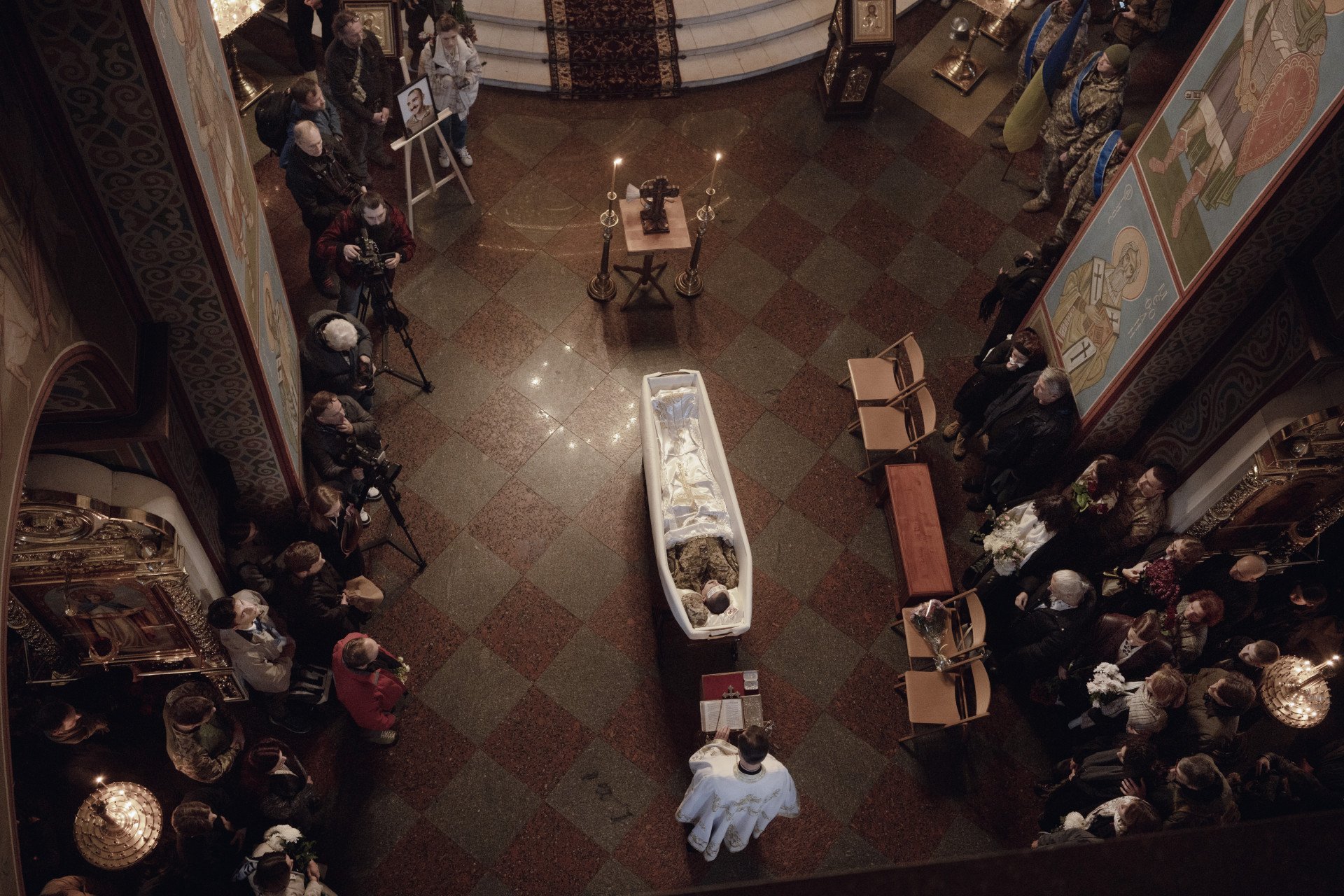 Kostiantyn Huzenko lies in repose at St. Michael’s Cathedral, as Kyiv gathers to honor the life of the young marine, photographer, and press officer lost to war. Photo by Joshua Olley/UNITED24 Media. Kostiantyn Huzenko lies in repose at St. Michael’s Cathedral, as Kyiv gathers to honor the life of the young marine, photographer, and press officer lost to war. Photo by Joshua Olley/UNITED24 Media.