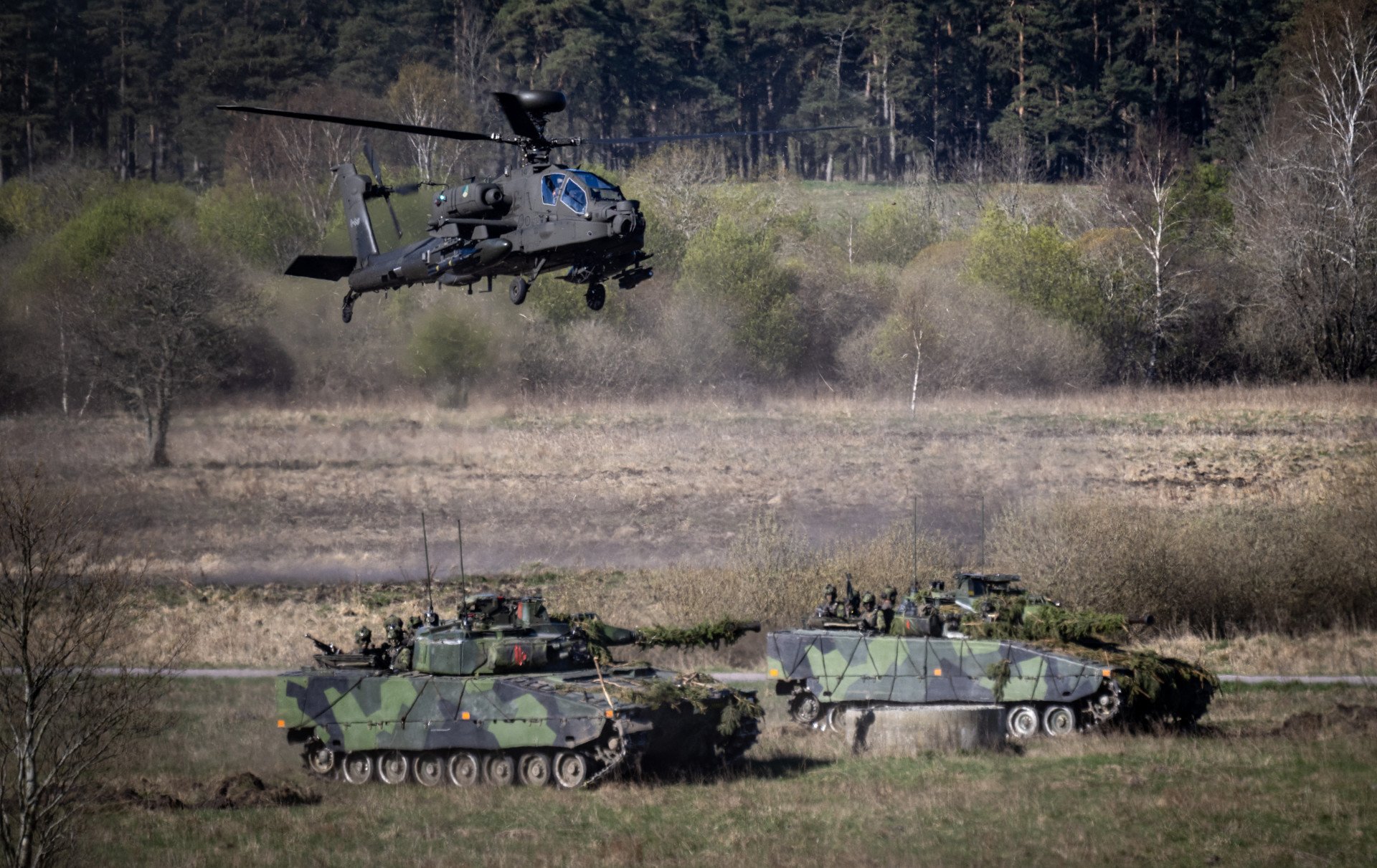 A Dutch Boeing AH-64 Apache attack helicopter flies over 2 Swedish Stridsfordon 90 tracked armoured combat vehicles as they take part in a combat display during press day for the military exercise Aurora 26 at the Revingehed training field outside Lund in Skane, Southern Sweden on April 29, 2026. Photo by Johan Nilsson via Getty Images A Dutch Boeing AH-64 Apache attack helicopter flies over 2 Swedish Stridsfordon 90 tracked armoured combat vehicles as they take part in a combat display during press day for the military exercise Aurora 26 at the Revingehed training field outside Lund in Skane, Southern Sweden on April 29, 2026. Photo by Johan Nilsson via Getty Images
