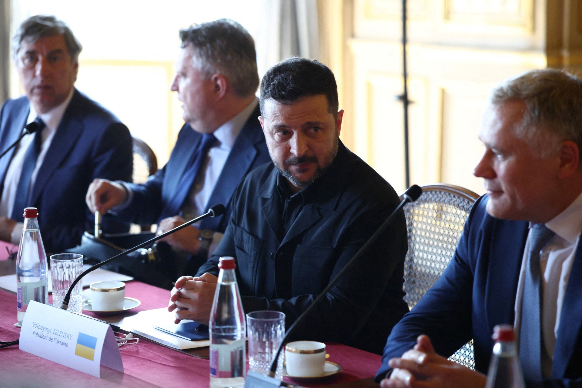 Ukraine's President Volodymyr Zelenskyy (C) looks on at the start of the Integrated Anti-Ballistic Missile Coalition meeting ahead of a summit of the Coalition of the Willing to support Ukraine at the Hotel des Invalides in Paris on July 13, 2026. (Photo by Tom Nicholson via Getty Images) Ukraine's President Volodymyr Zelenskyy (C) looks on at the start of the Integrated Anti-Ballistic Missile Coalition meeting ahead of a summit of the Coalition of the Willing to support Ukraine at the Hotel des Invalides in Paris on July 13, 2026. (Photo by Tom Nicholson via Getty Images)