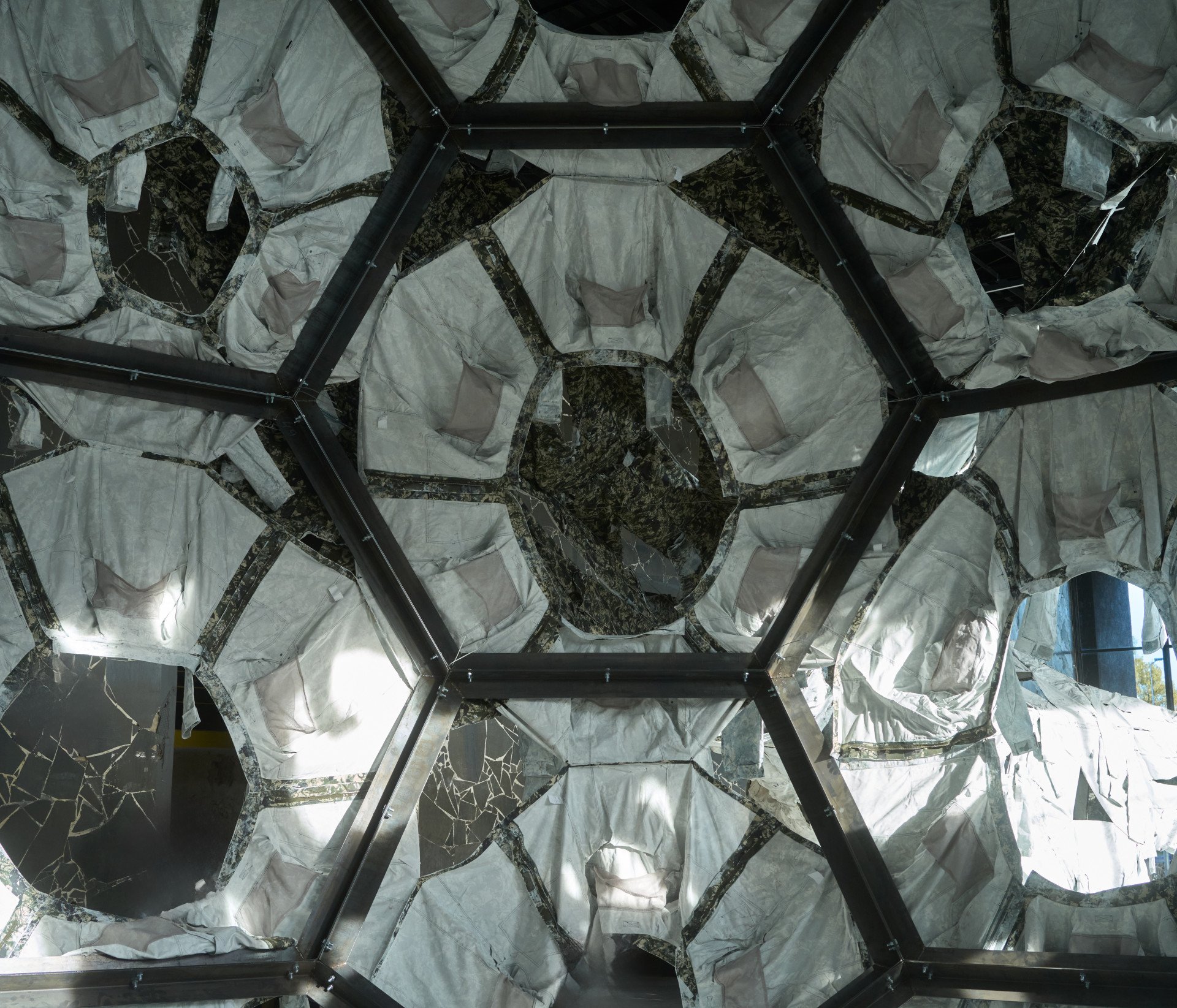 Inside view of one of the spheres of Ai Weiwei’s Three Perfectly Proportioned Spheres and Camouflage Uniforms Painted White. (Source: UNITED24 Media/Joshua Olley)