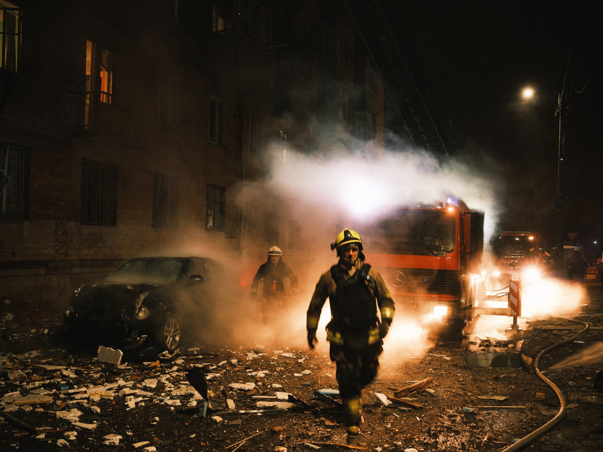 Firefighters continue to extinguish the fire on the fifth floor of a residential building following the Russian Shahed drone attack on Kharkiv, Ukraine on March 02, 2025. (Photo by George Ivanchenko via Getty Images)