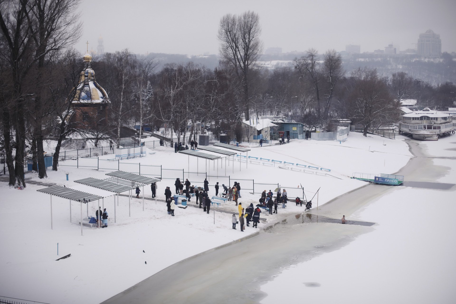 A view from the bridge that straddles the banks of the Dnipro, as celebrants of the Epiphany gather below. Kyiv, Ukraine, January 6, 2026. (Photo: Lucile Brizard) A view from the bridge that straddles the banks of the Dnipro, as celebrants of the Epiphany gather below. Kyiv, Ukraine, January 6, 2026. (Photo: Lucile Brizard)