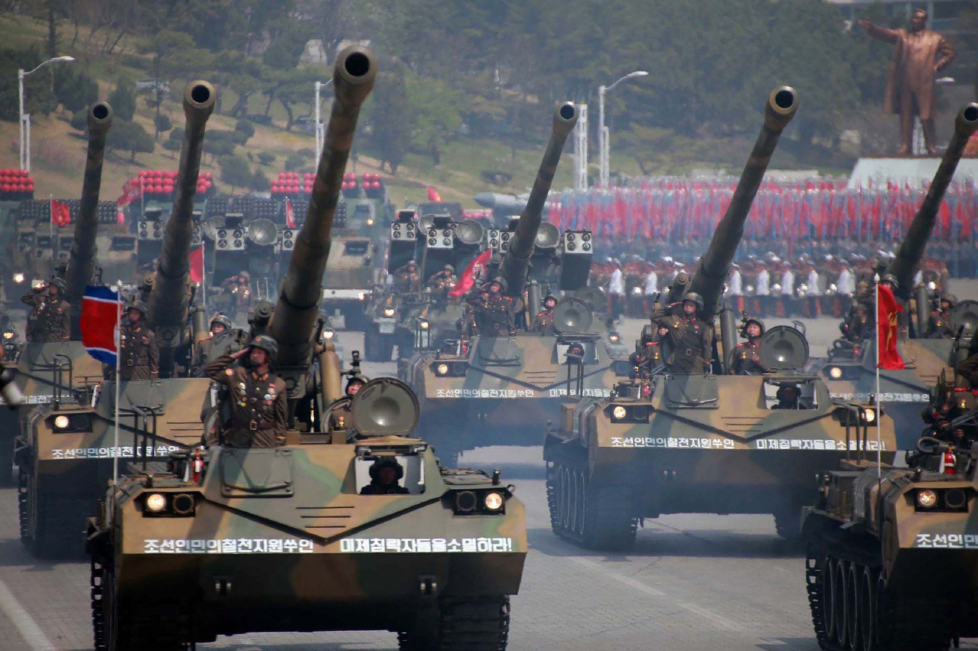 Korean People's howitzers being displayed through Kim Il-Sung square during a military parade in Pyongyang