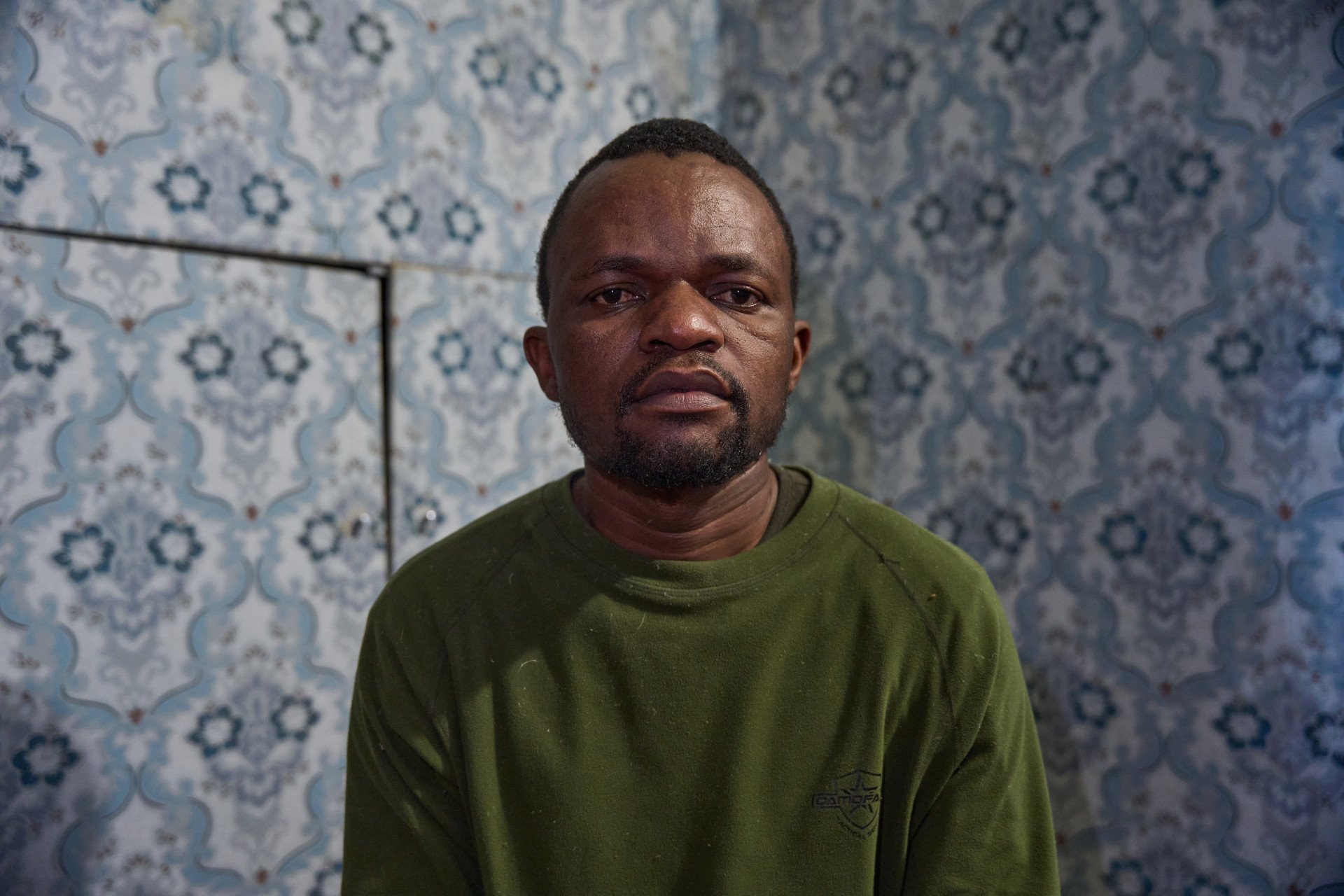 Tatenda Tarwire, a 37-year-old Zimbabwean national currently held as a prisoner of war (POW) by Ukraine. Tarwire is one of thousands of foreign recruits lured to Russia with false promises of employment before being forced into a military contract that sent him to the frontlines. (Photo: Mykyta Shandyba / UNITED24 Media) Close-up portrait of Tatenda Tarwire, a 37-year-old prisoner of war (POW) from Zimbabwe held in Ukraine, who was lured to Russia under false pretenses and forced to sign a Russian military contract.