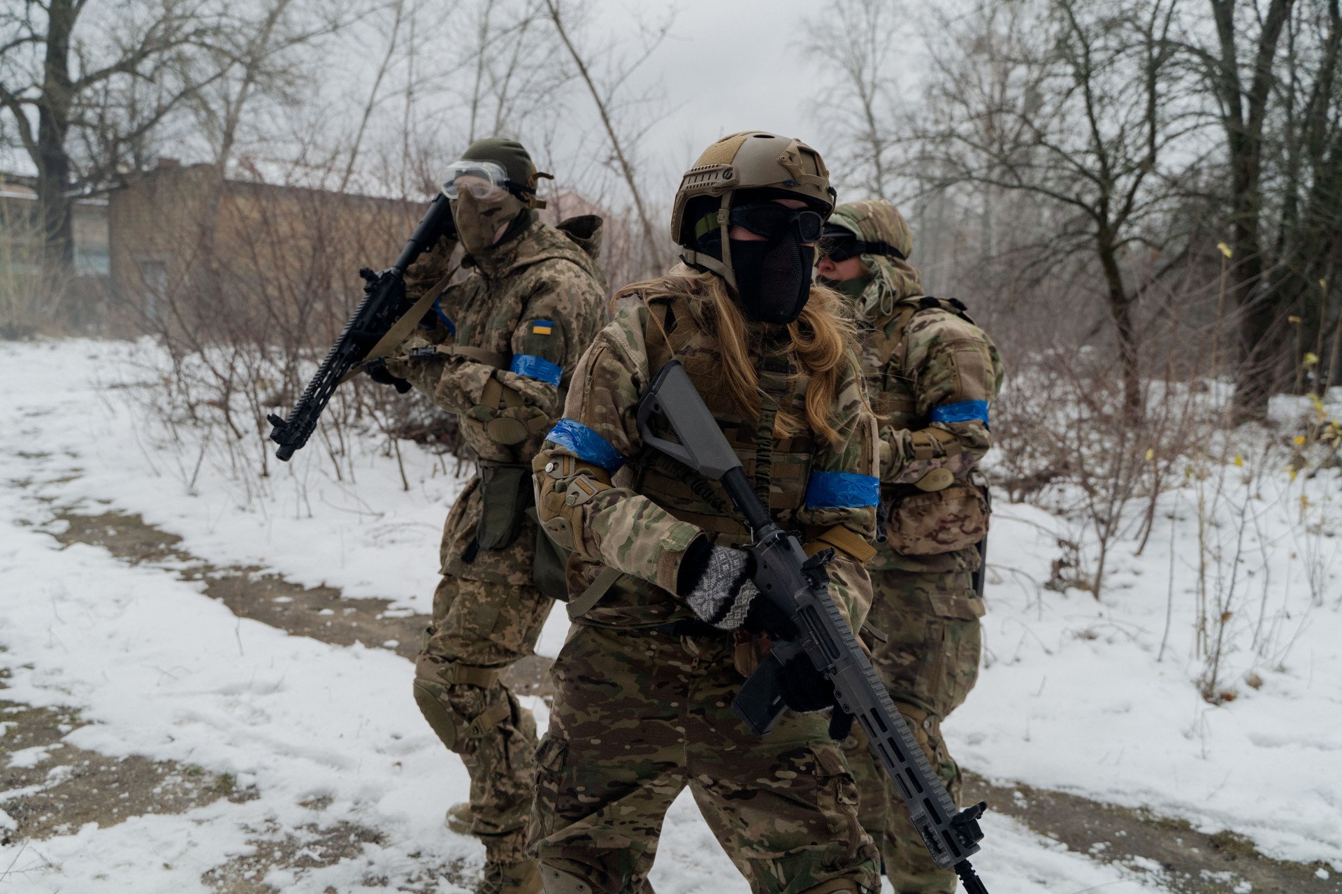 Ukrainian soldier wearing mixed camouflage patterns on the front line