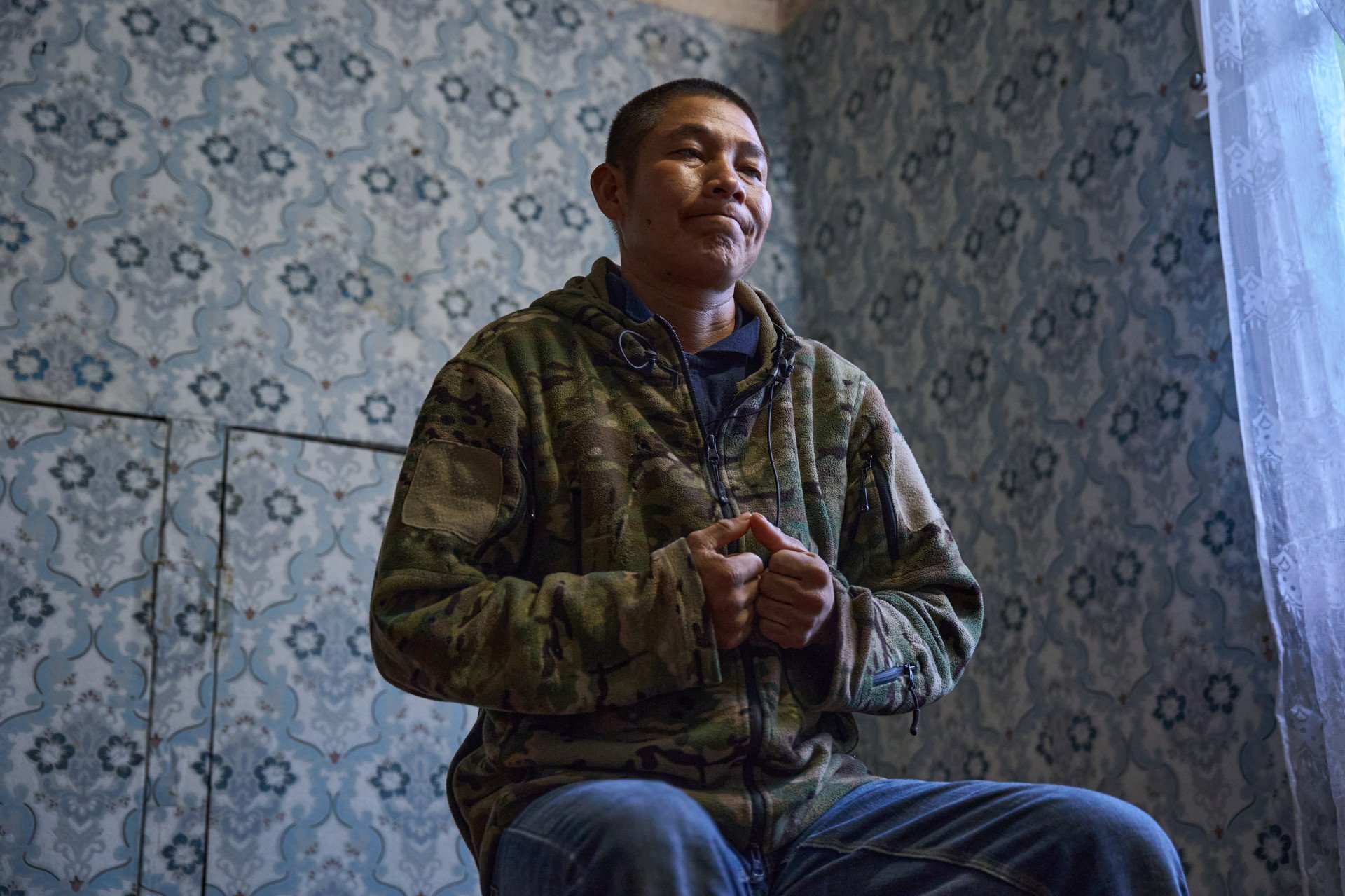 Recently captured by the Ukrainian military after being forcefully deployed by Russia, Peruvian national Americo Valdivia Teco speaks about the psychological terror of life on the frontlines. Valdivia Teco recounted living in a state of constant fear and expressed deep anguish for his family back in Peru, who remain entirely unaware of whether he is alive or dead. (Photo: Mykyta Shandyba / UNITED24 Media) Peruvian prisoner of war (POW) Americo Valdivia Teco looks up with tightly clasped hands during an interview, visibly distressed as he recounts the constant fear he endured in the Russian army and his anguish over his family not knowing his fate.