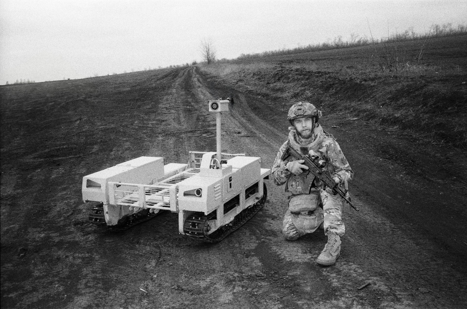 Bar, 22, a member of the famed 3rd Assault, stands proudly with his robot “TerMIT,” showcasing innovation and resilience on the front lines. Bar, 22, a member of the famed 3rd Assault, stands proudly with his robot “TerMIT,” showcasing innovation and resilience on the front lines.