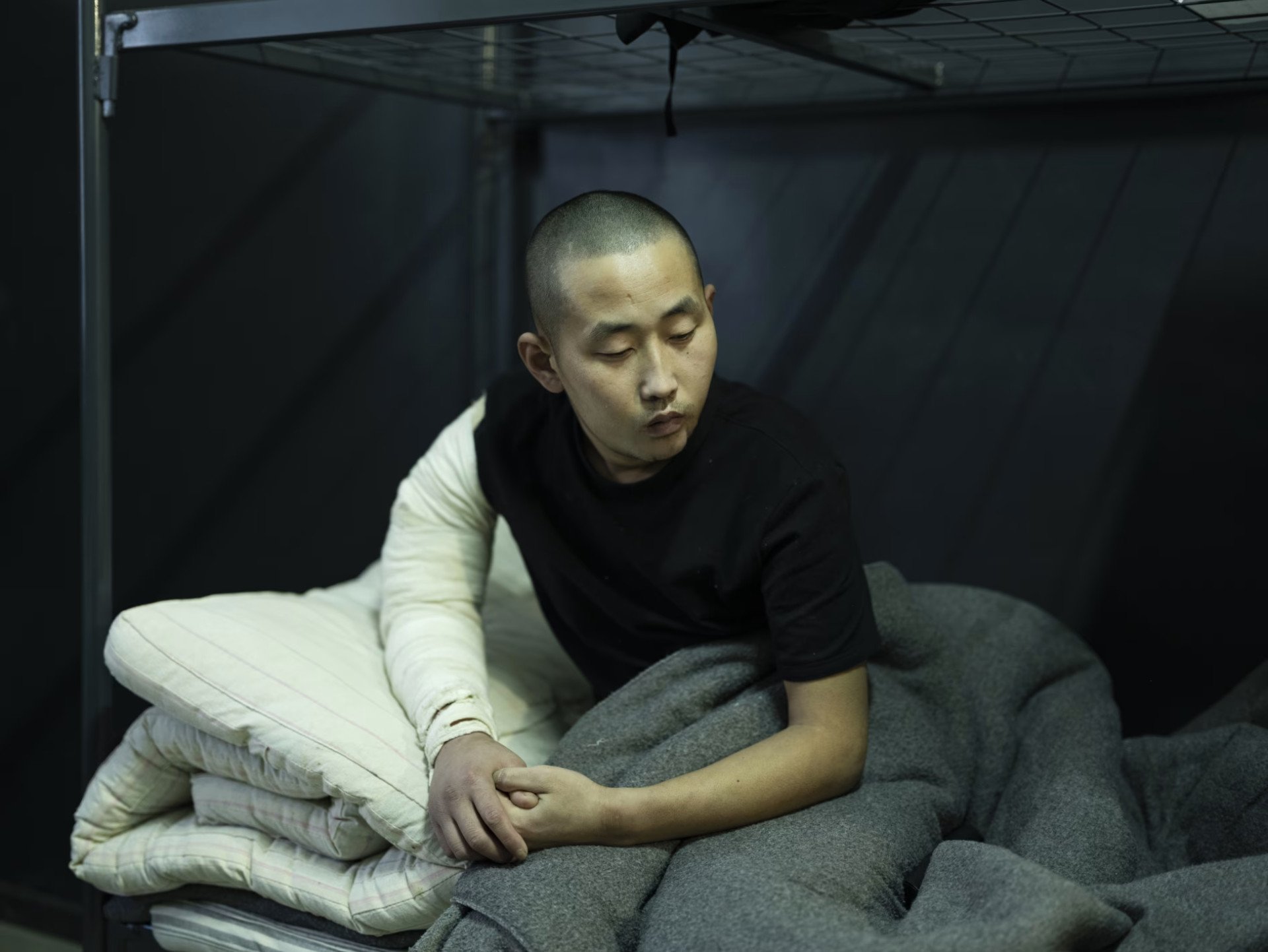 MAR 05 — North Korean soldier Ri, 26, captured by Ukrainian forces, was led to believe they would be fighting South Koreans aiding Ukraine. Instead, they found themselves battling Ukrainians in Russia’s Kursk region. Indoctrinated by North Korea’s secret police, Ri was taught that surrender was treason—until the battlefield revealed a different reality. (Photo by Sasha Maslov for WSJ)